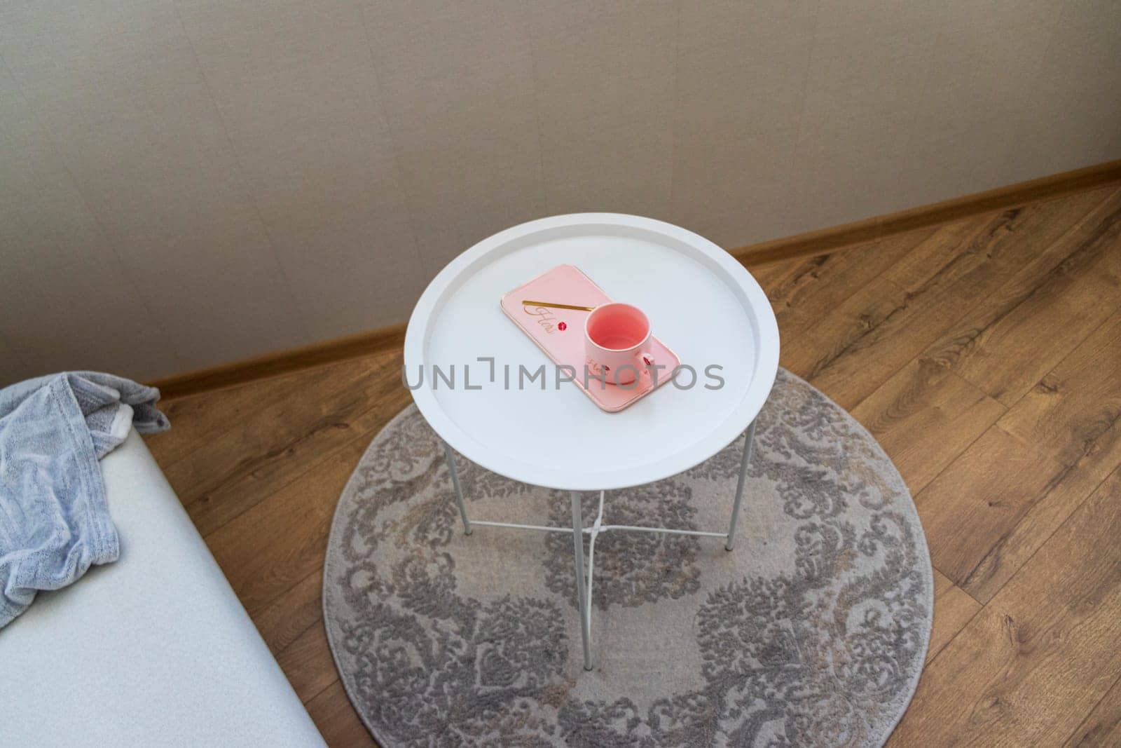 Coffee table with the pink cup for ladies on it