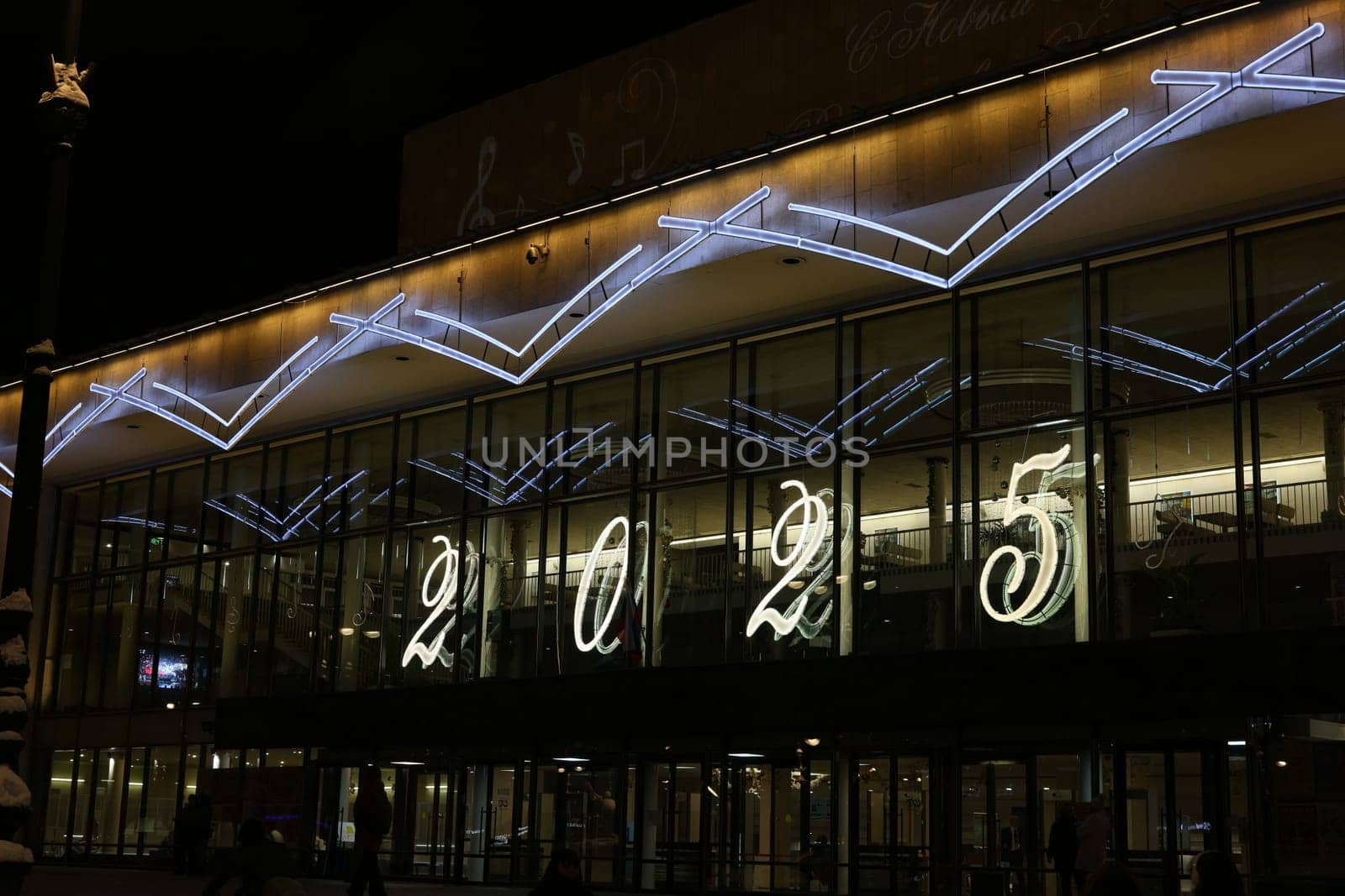 A vibrant night scene showcasing a breathtaking light display, celebrating the arrival of the year 2025