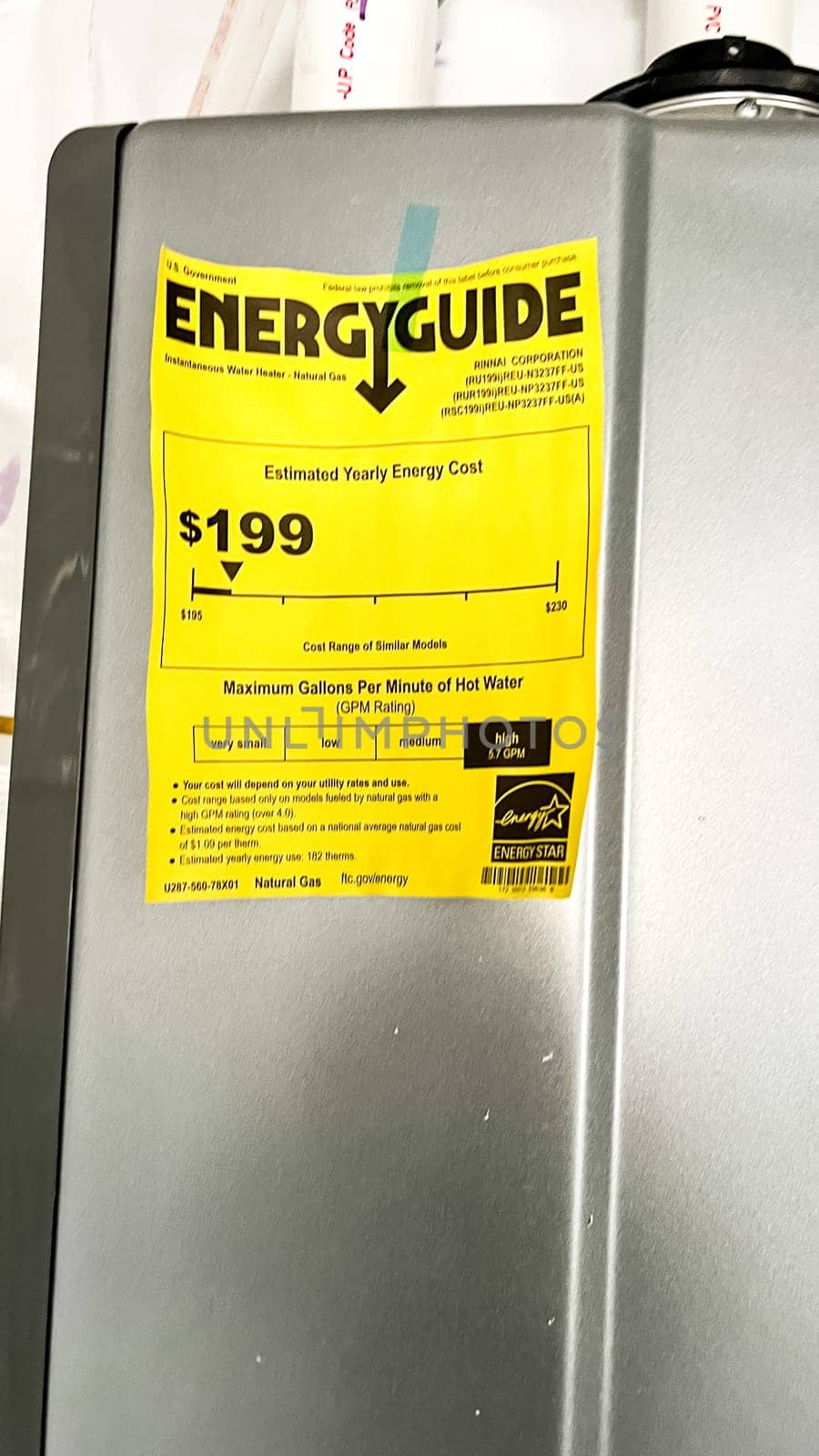 Parker, Colorado, USA-January 11, 2023-A Rinnai tankless water heater installed in the basement of a newly constructed residential home. The energy-efficient unit provides on-demand hot water and features an Energy Guide label for performance specifications.