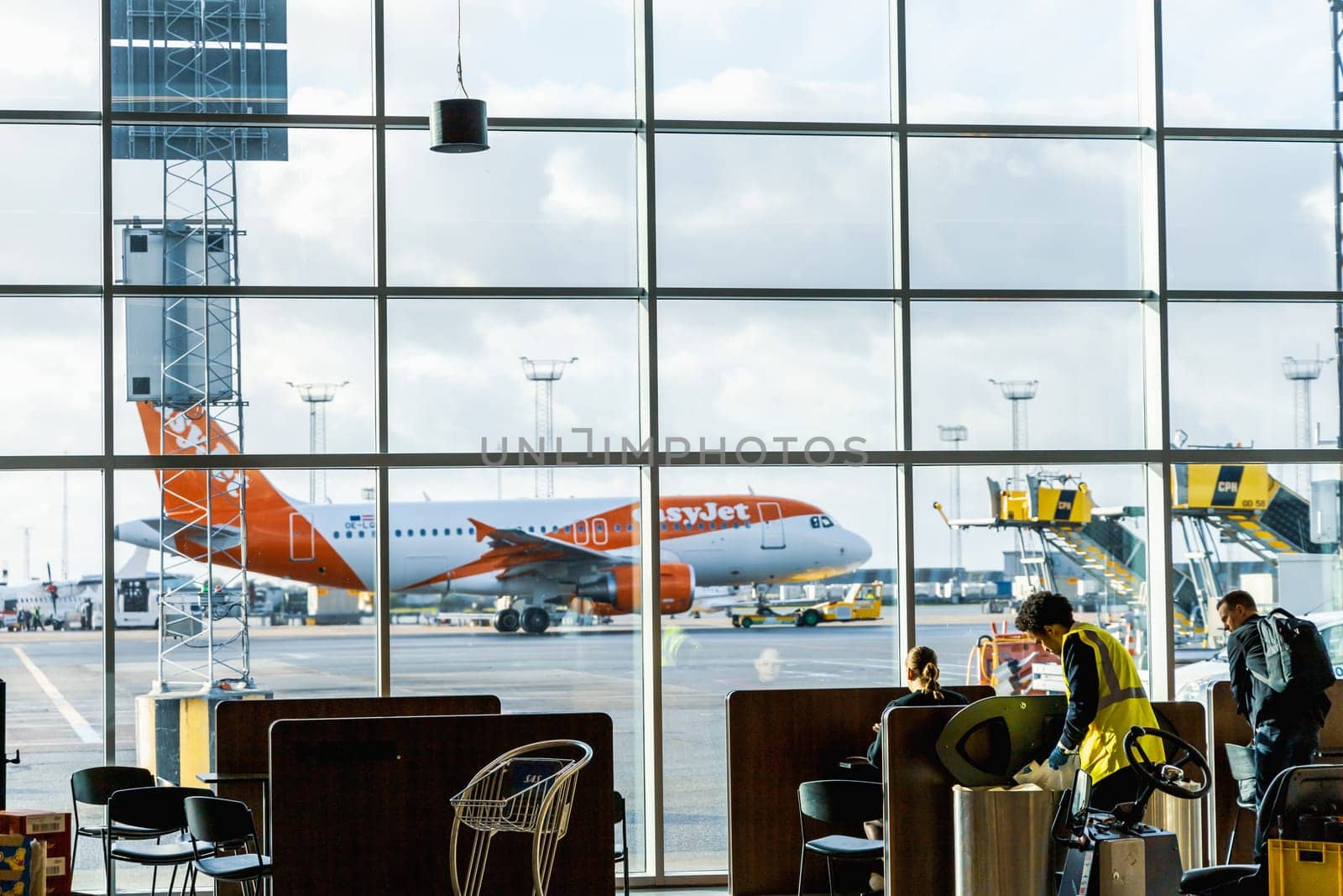 Easy Jet plane parked at Copenhagen airport. Travel by plane. Copenhagen, Denmark - November 27, 2024