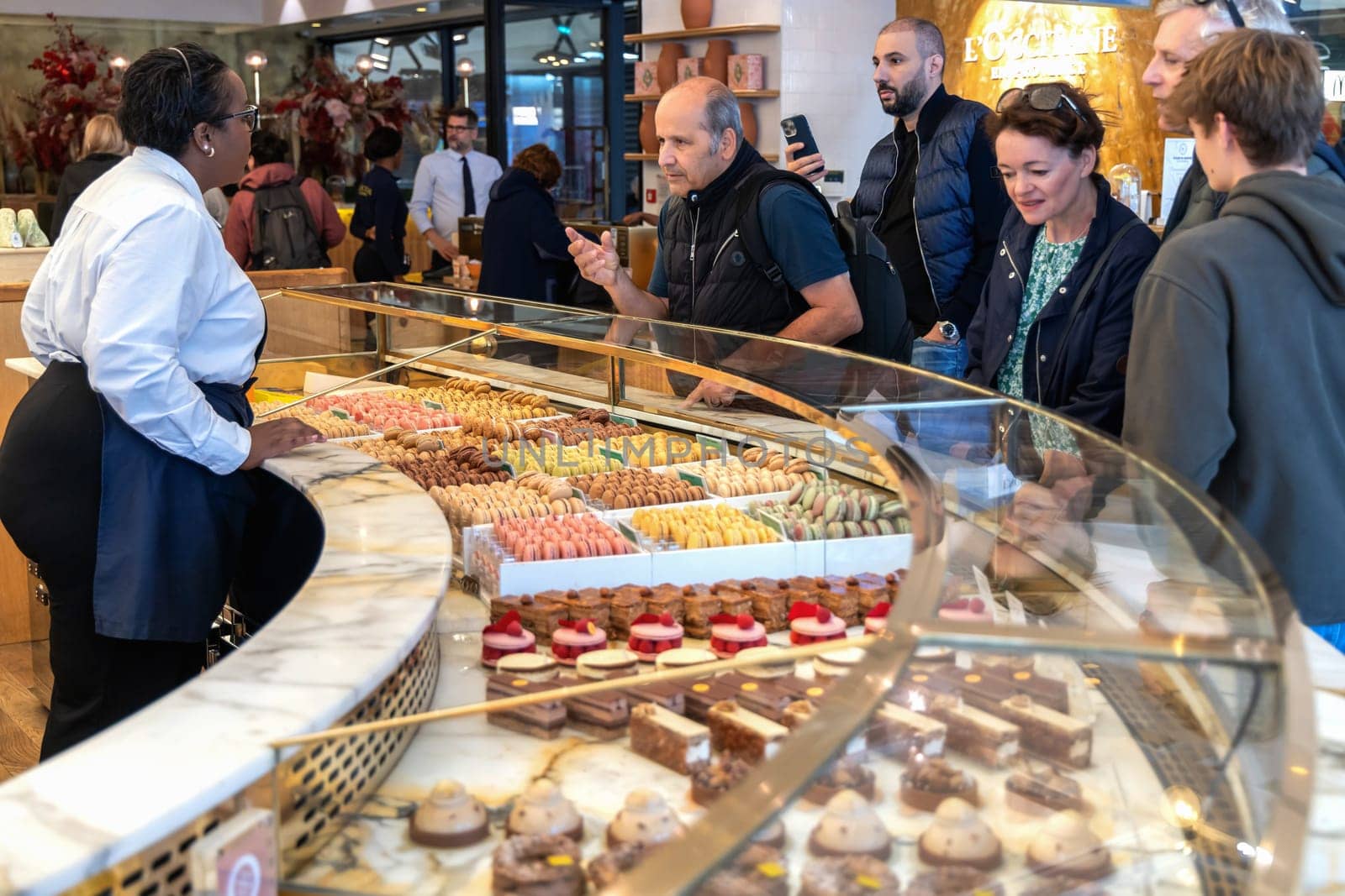 Various assortment of desserts confectionery on the counter in a bakery. Paris, France - November 15, 2024