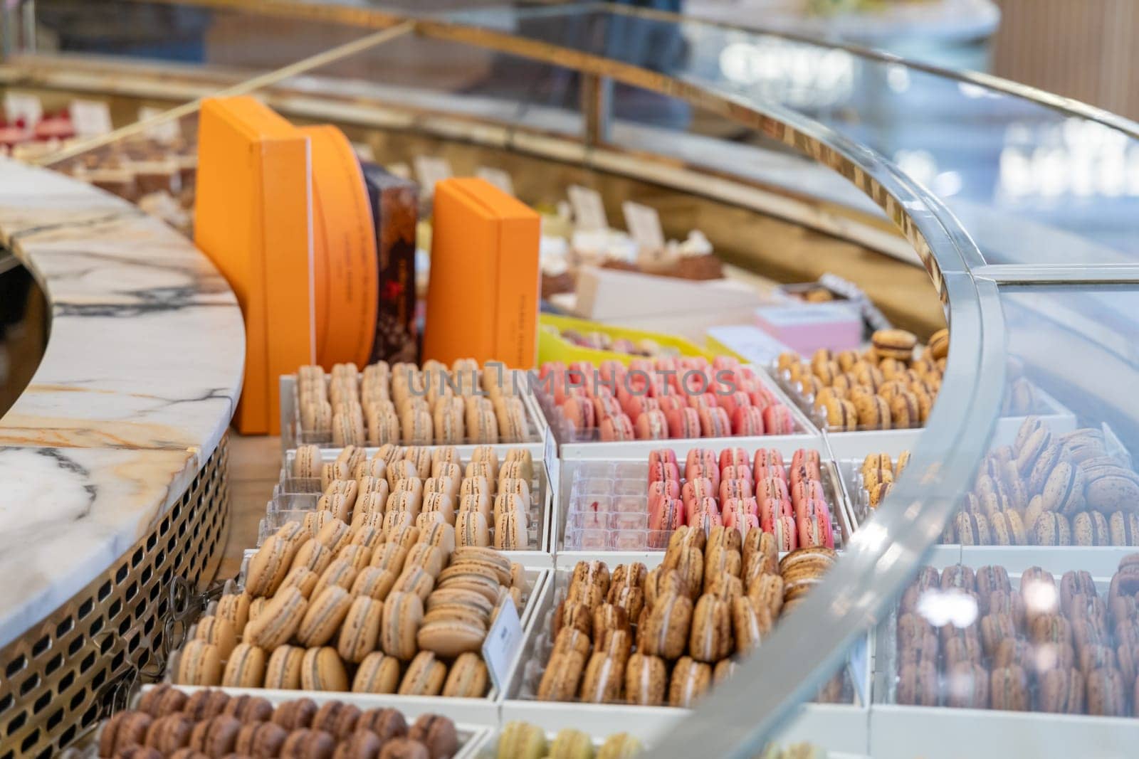 Various assortment of desserts confectionery on the counter in a bakery. Paris, France