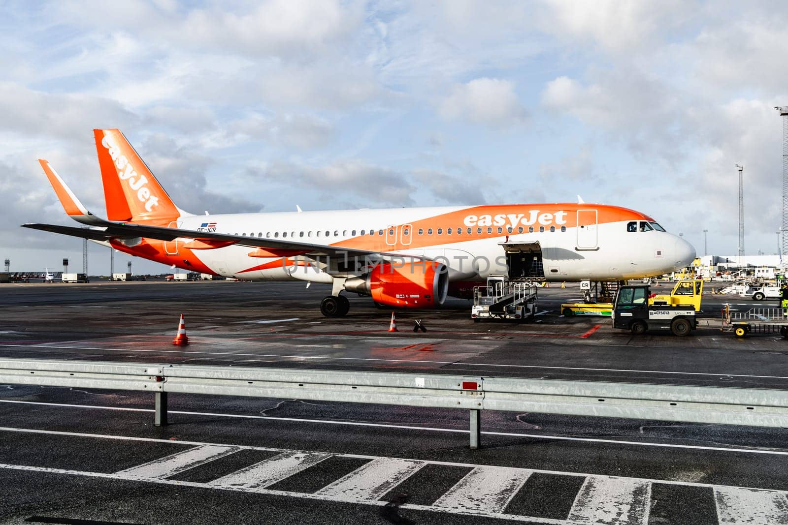 Easy Jet plane parked at Copenhagen airport. Travel by plane. Copenhagen, Denmark - November 27, 2024