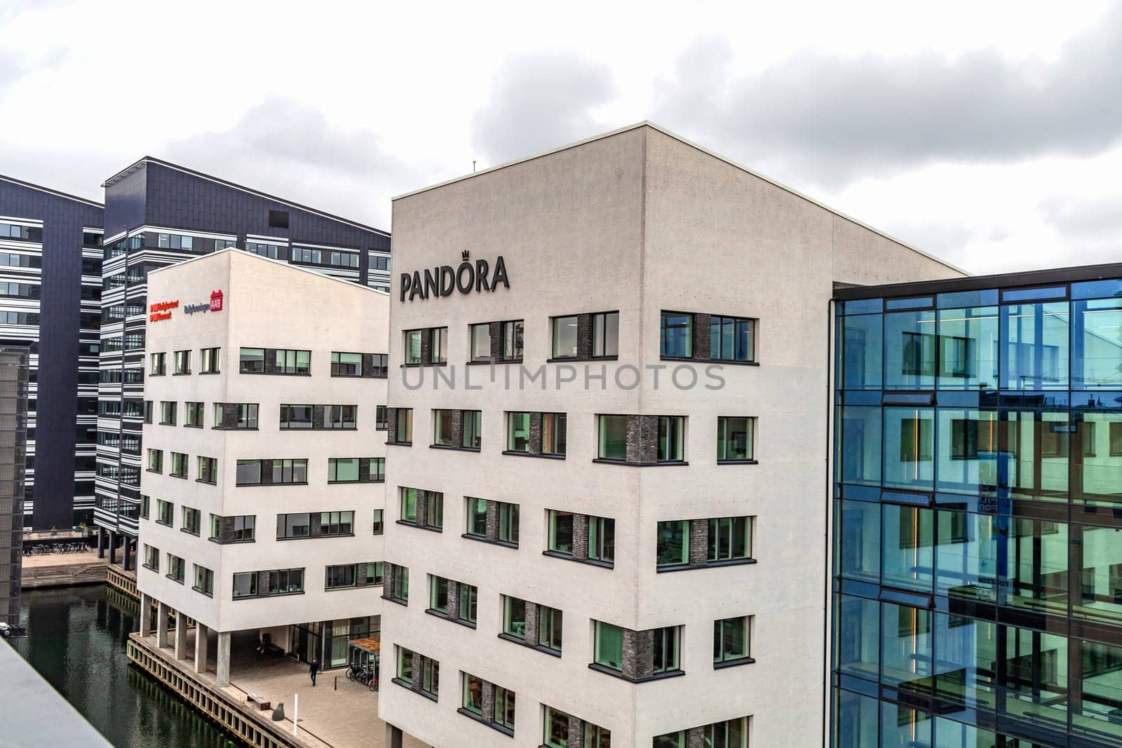 Building of the Pandora jewelry company. Modern glass office building in an expensive area of Copenhagen, Denmark - September 15, 2023.