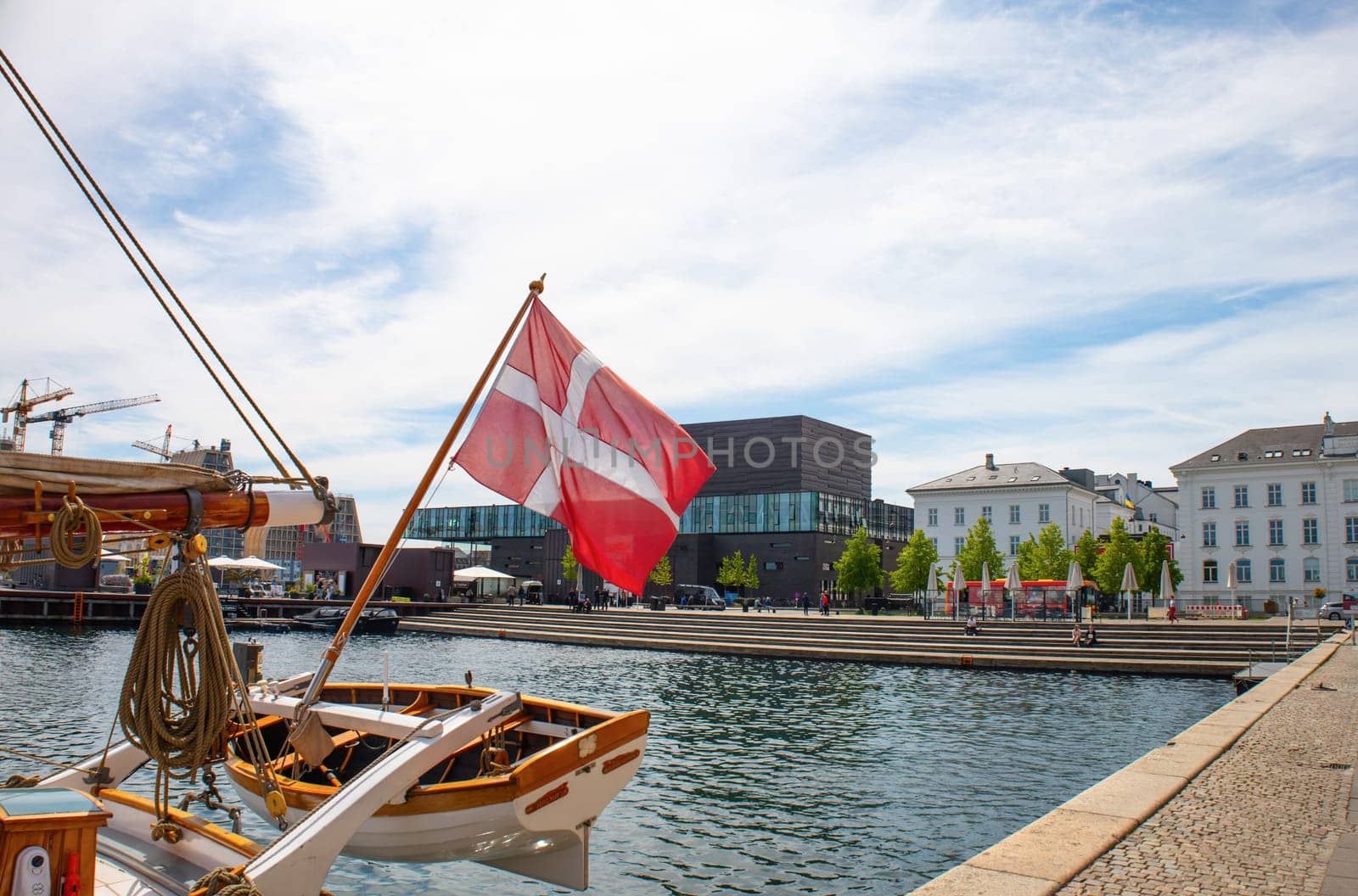 Copenhagen, Denmark - May 15, 2023. Danish flag on the mast of the yacht in Copenhagen. High quality photo