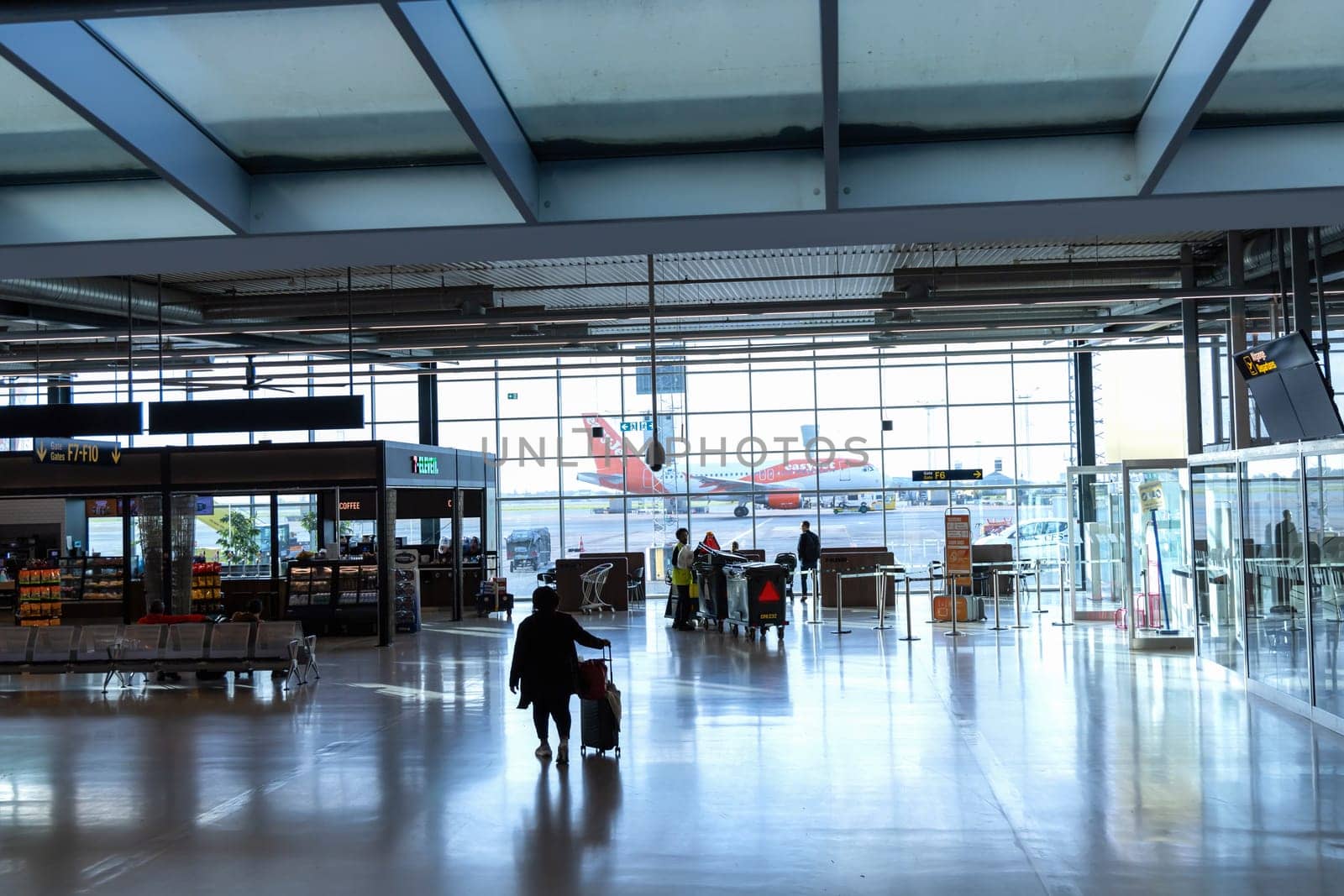Easy Jet plane parked at Copenhagen airport. Travel by plane. Copenhagen, Denmark - November 27, 2024