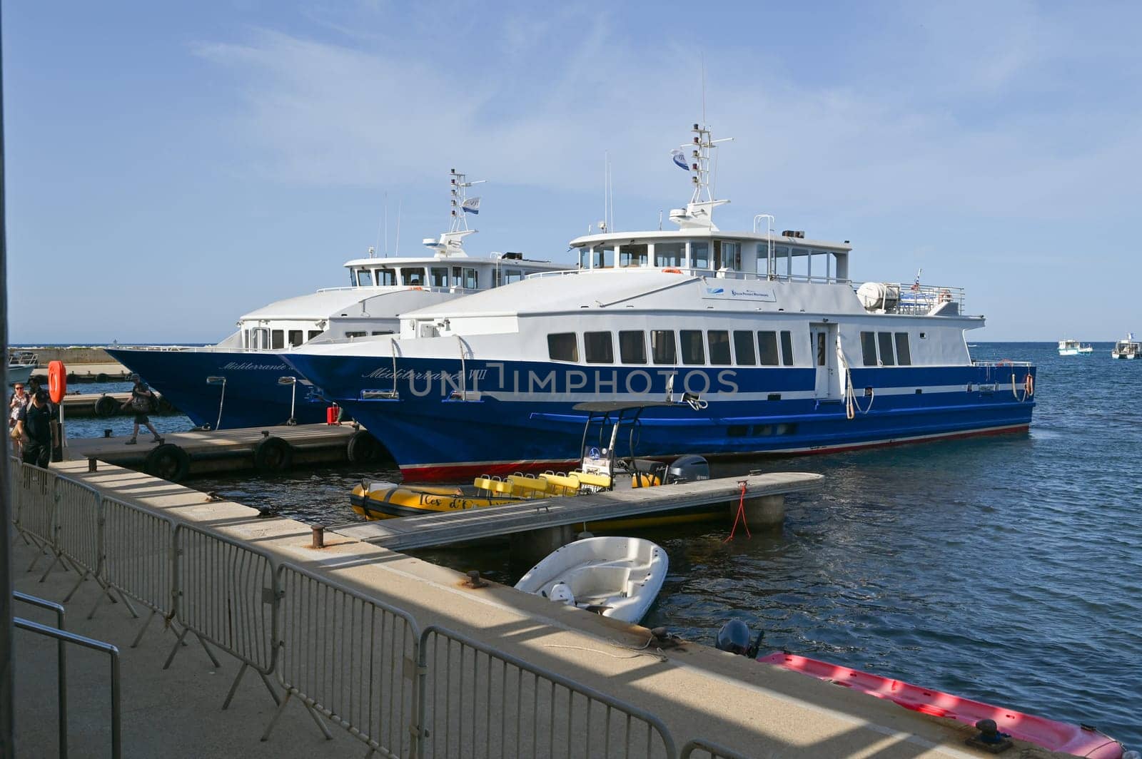 Porquerolles, France - June 14 2024: Passenger ferry between Hyeres and Porquerolles island making an arrival maneuver. High quality photo