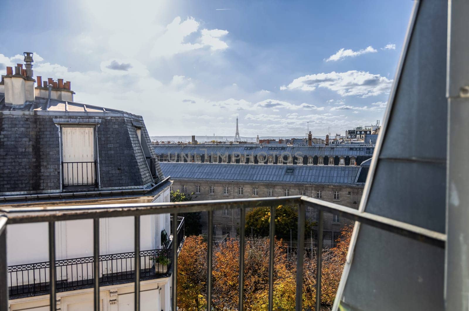 View from the open window of the city of Paris rooftops and Eiffel Tower. Paris, France. High quality photo