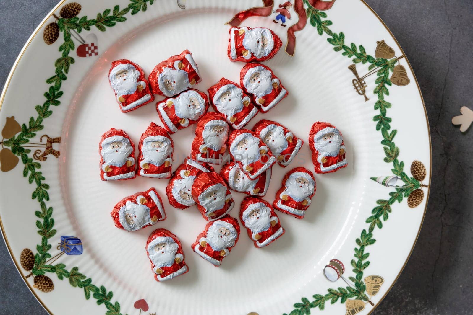 Christmas chocolates. Chocolate Santa Claus in a Christmas plate. High quality photo