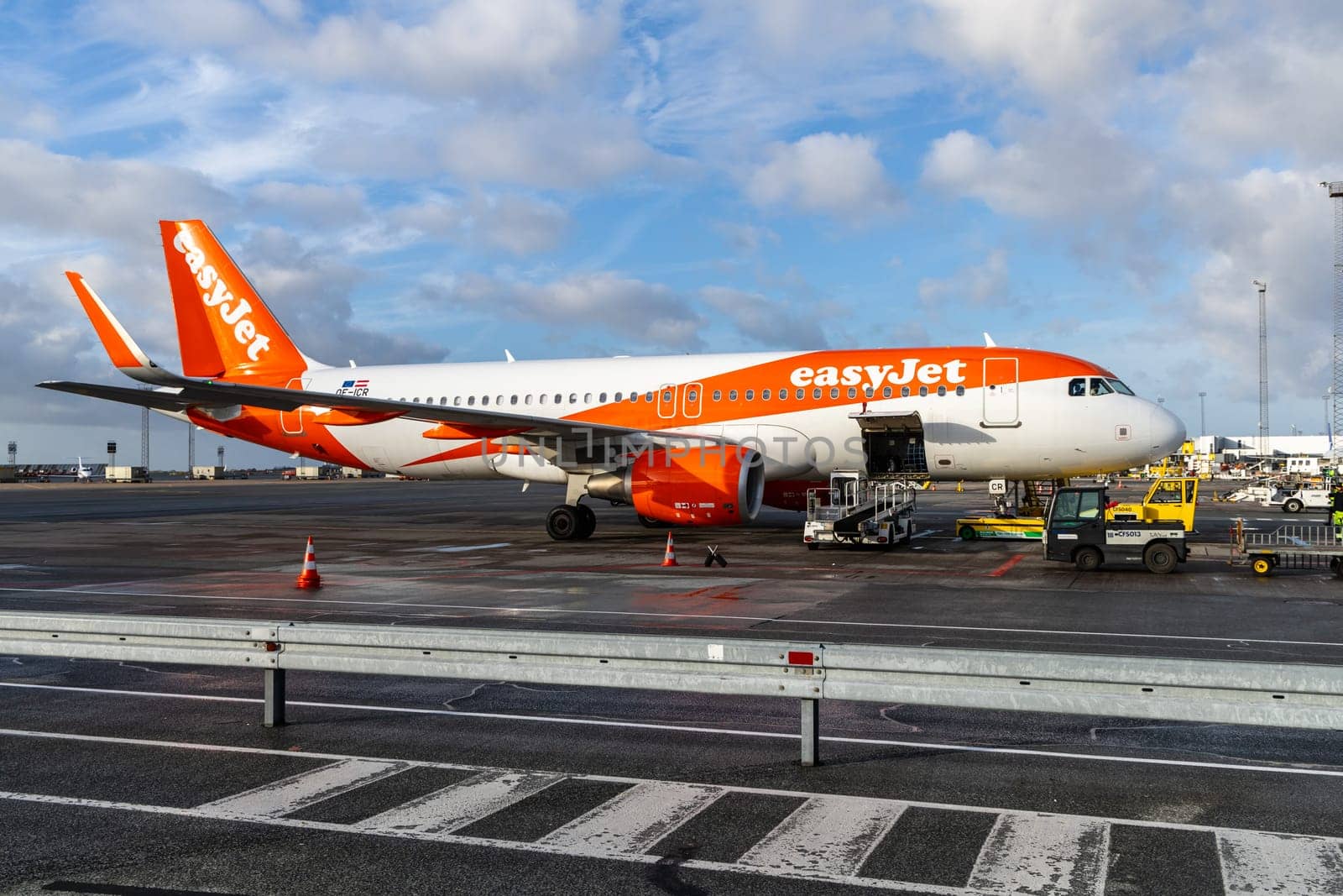 Easy Jet plane parked at Copenhagen airport. Travel by plane. Copenhagen, Denmark - November 27, 2024