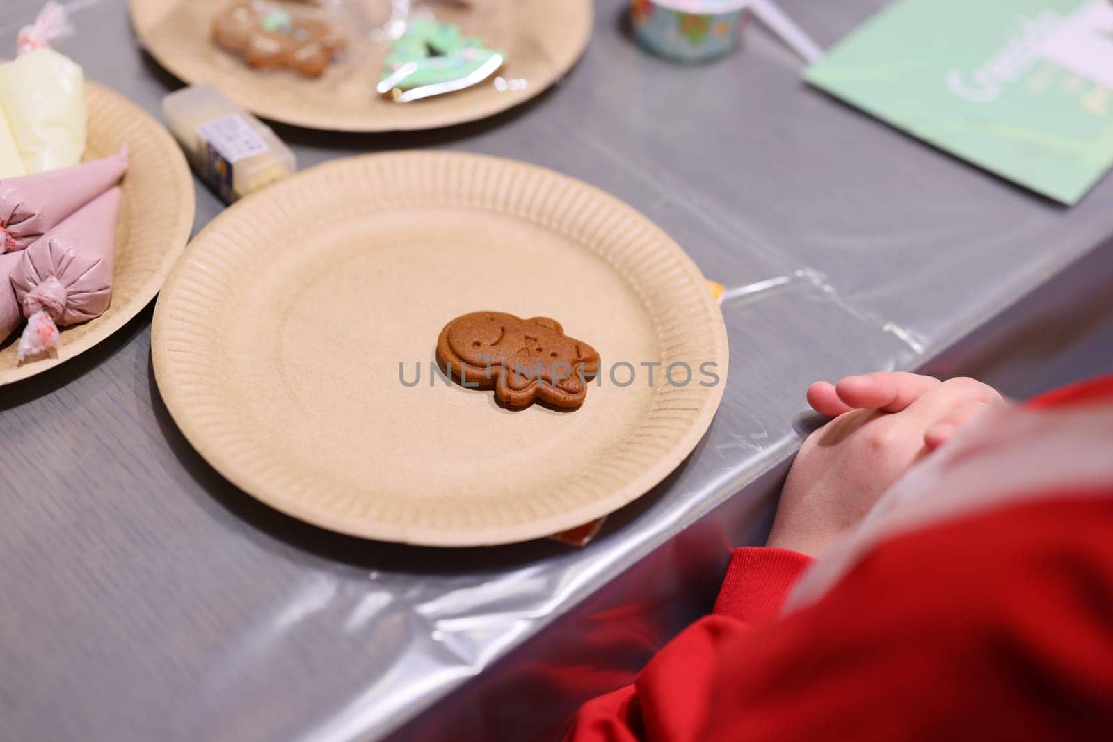 A charming festive setting featuring a delightful gingerbread cookie, perfect for all holiday celebrations