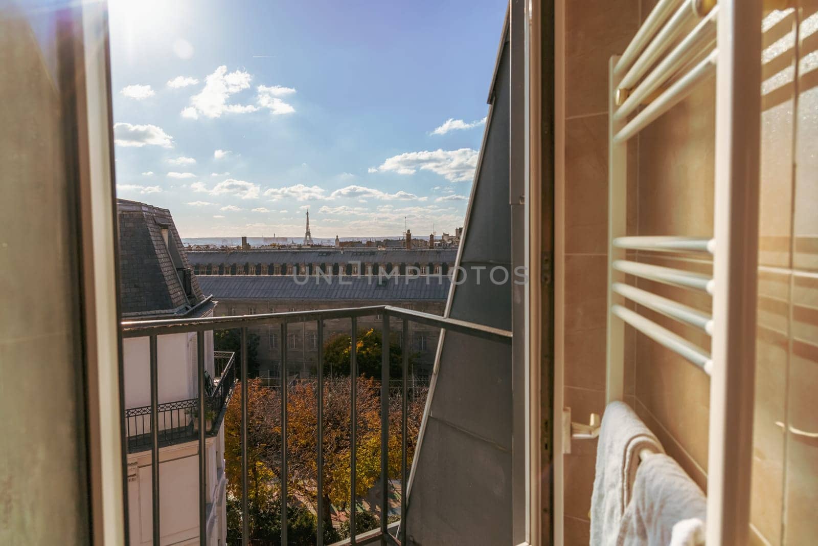 View from the open window of the city of Paris rooftops and Eiffel Tower. Paris, France. High quality photo