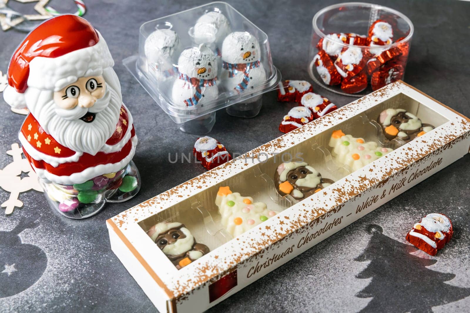 Christmas chocolates. Chocolate Christmas trees and Santa Claus. High quality photo