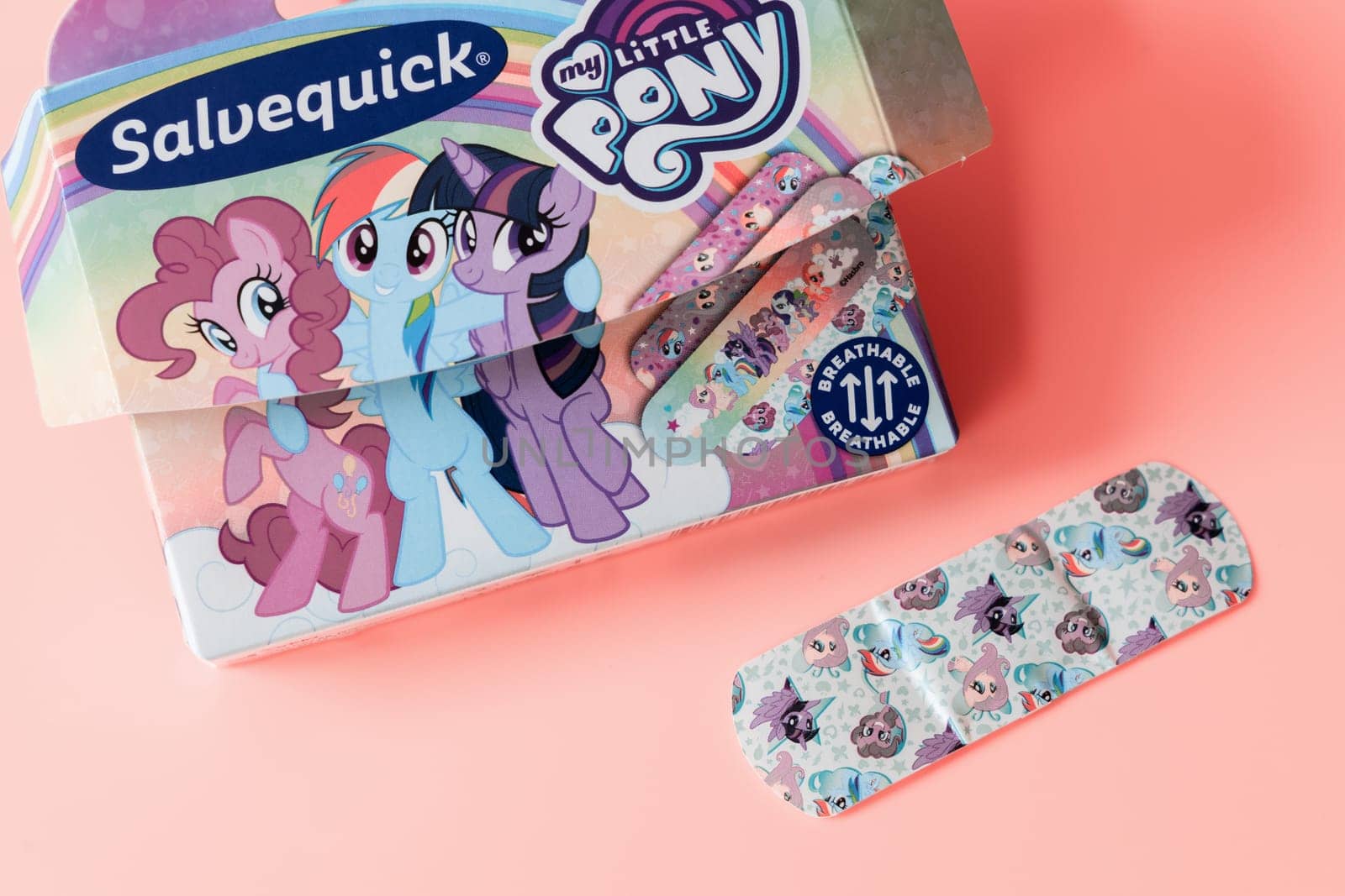 Children's colorful pony medical plaster on a pink background. Copenhagen, Denmark - Oktober12, 2023