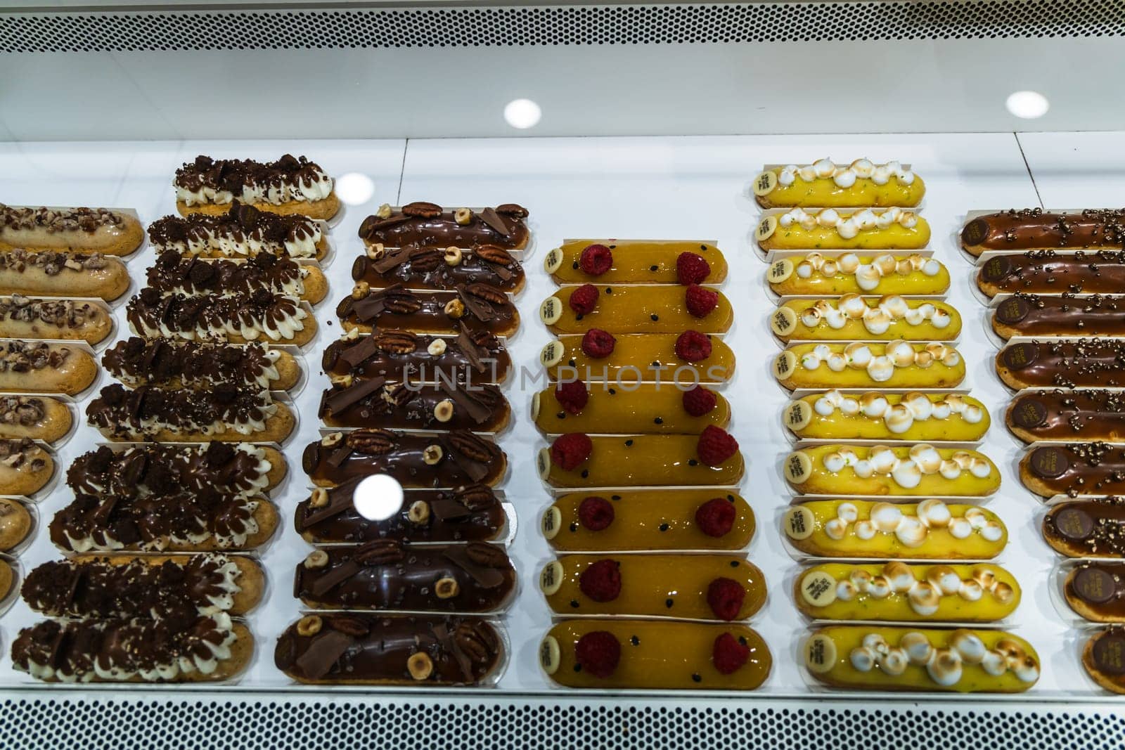 Various assortment of desserts confectionery on the counter in a bakery. Paris, France - November 15, 2024