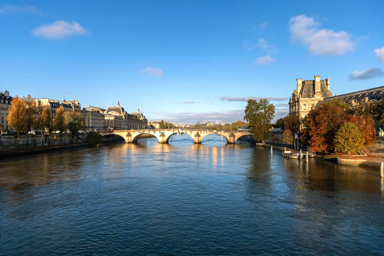Beautiful cityscape with view of the Seine River and bridge. Paris, France - November 5, 2024