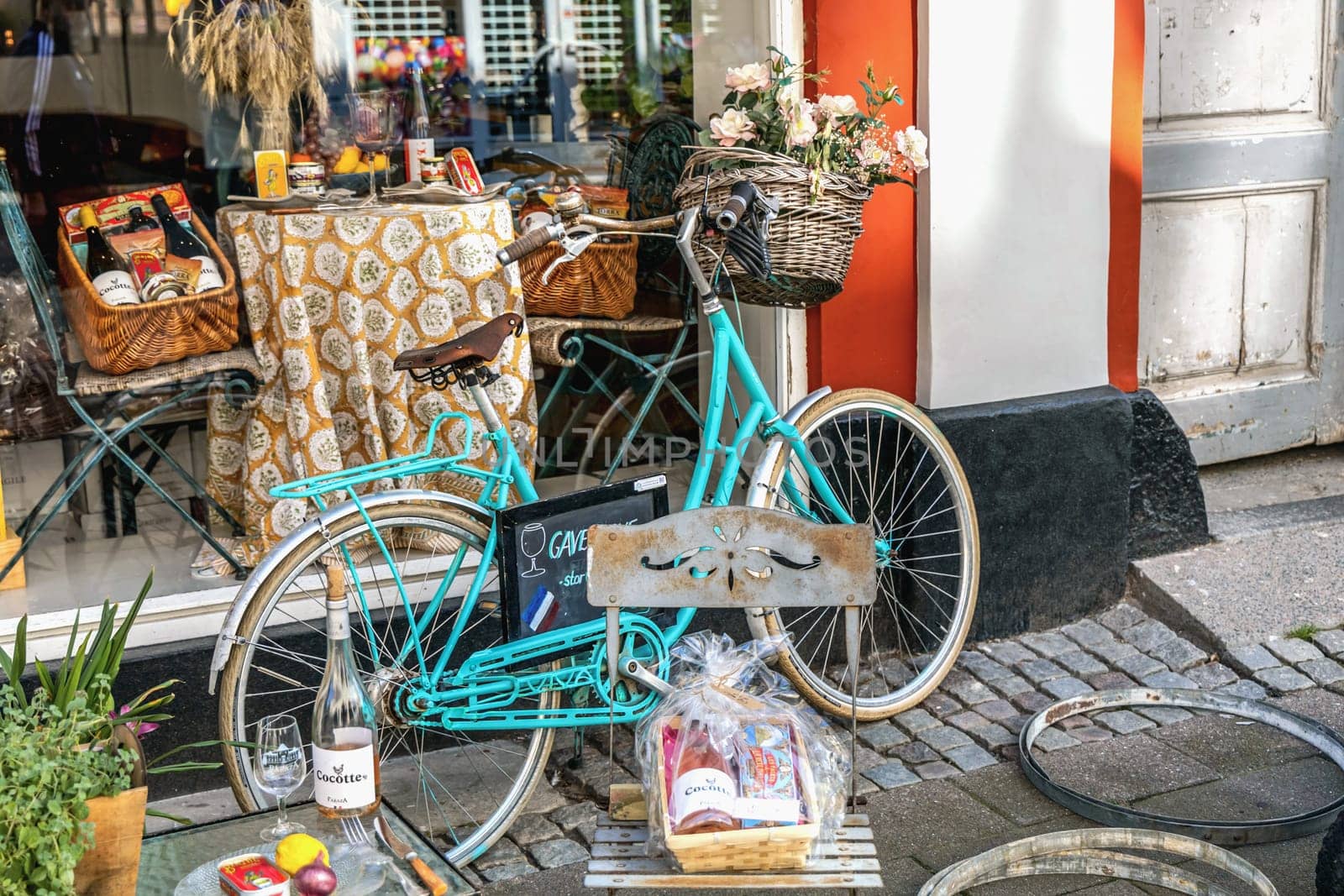 French wine shop window and street decorations outside the shop, Helsingor Denmark - September 17, 2024.