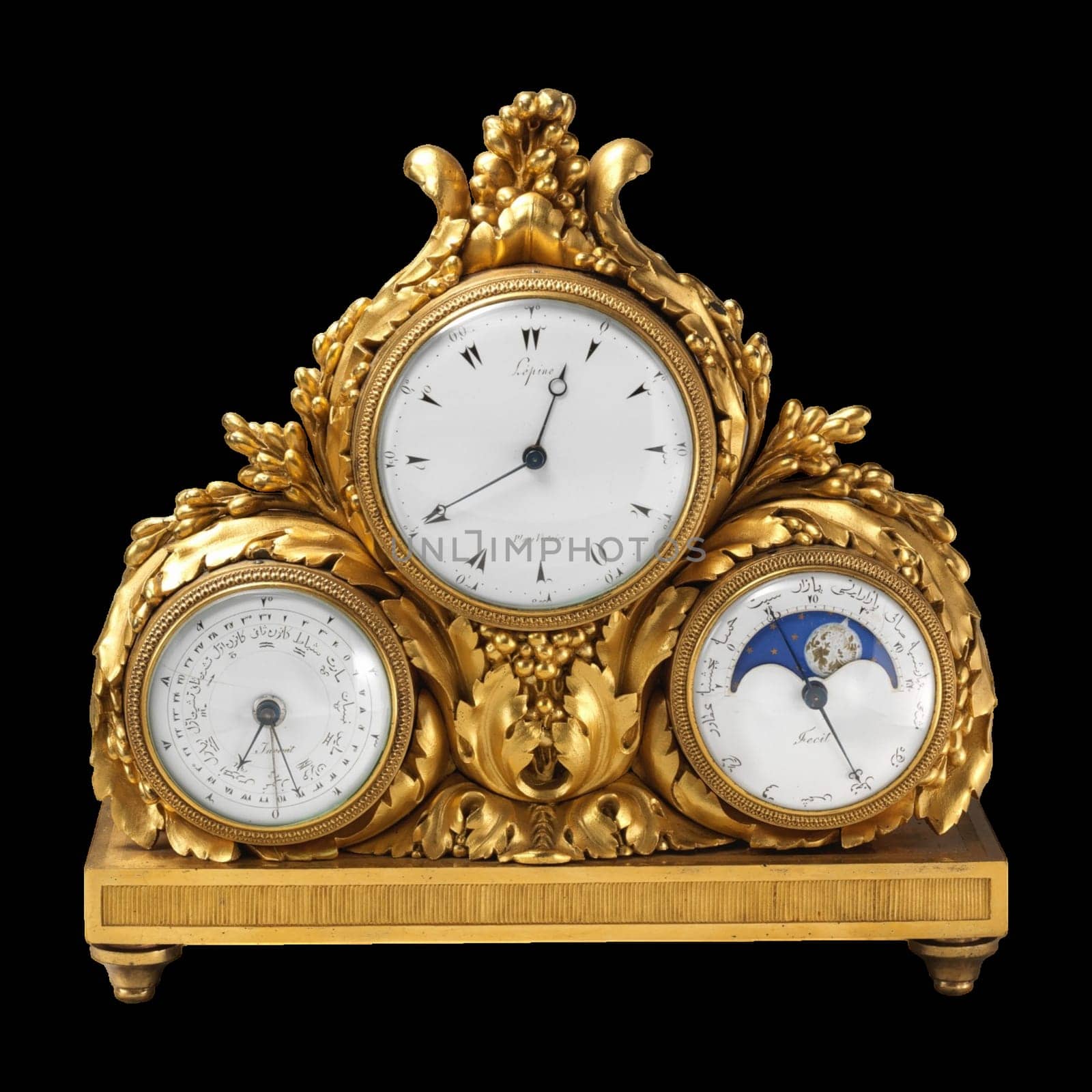 A close-up of a gilded antique clock with a perpetual calendar and moon phase display. The clock face features elegant Arabic numerals.