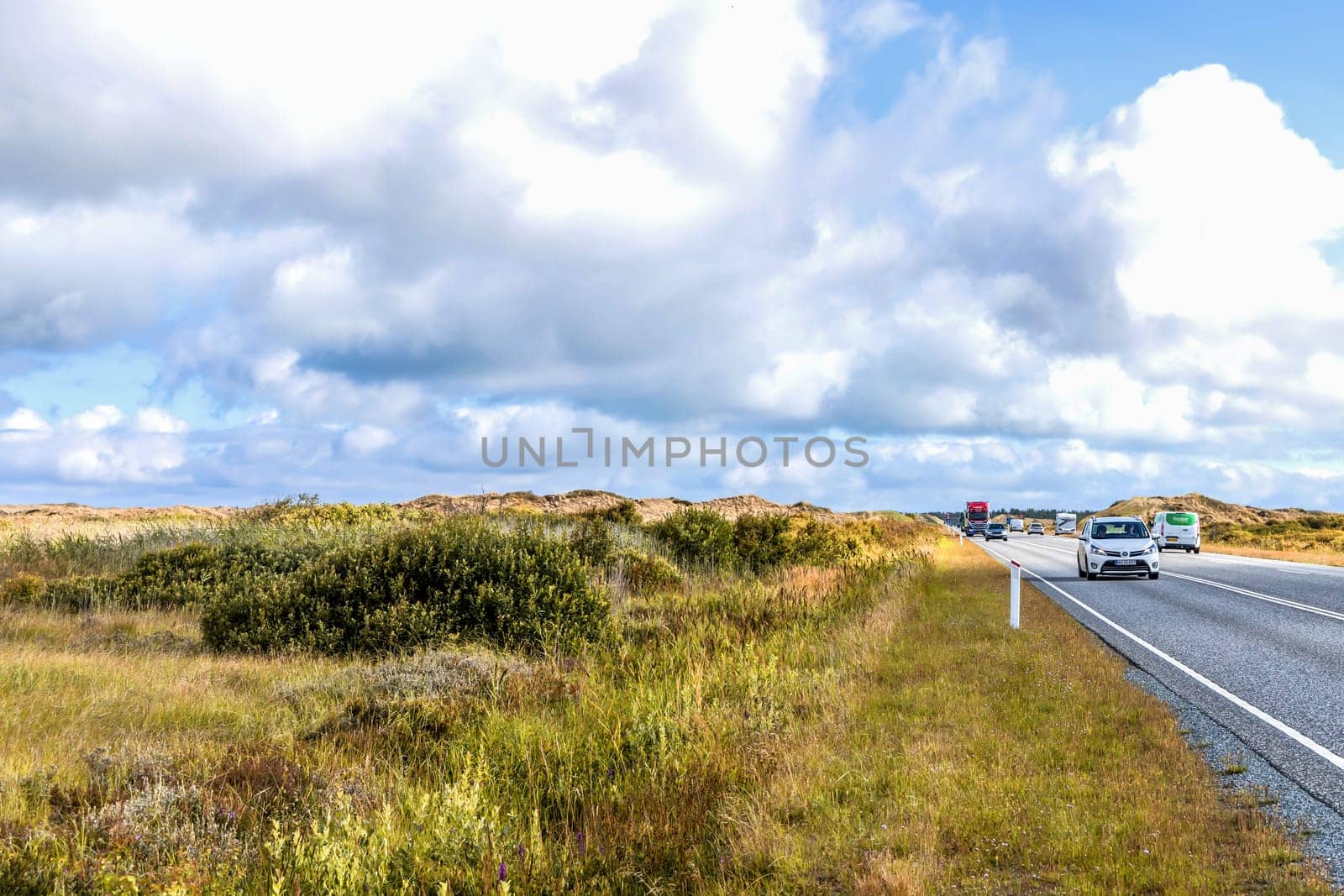 Highway with cars on a cloudy day. Denmark - Oktober 11, 2023