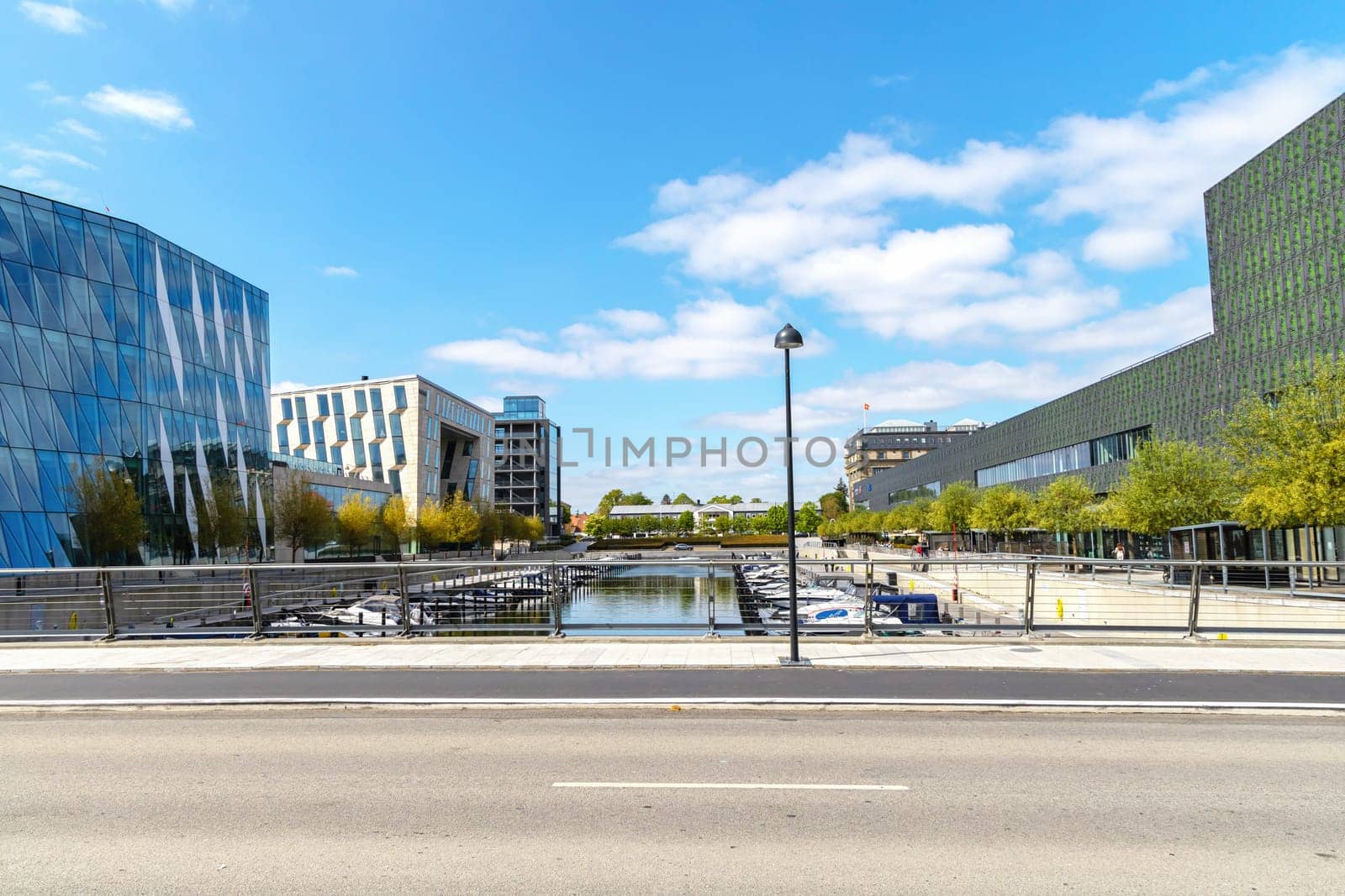 Modern glass office building in an expensive area of Copenhagen, Denmark - August 30, 2023.