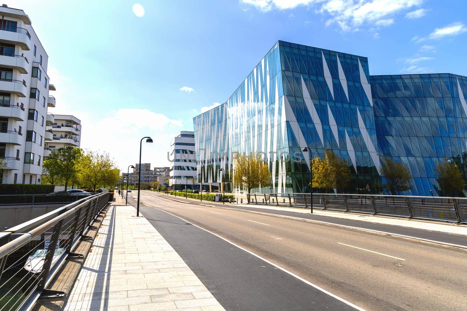 Modern glass office building in an expensive area of Copenhagen, Denmark - August 30, 2023.