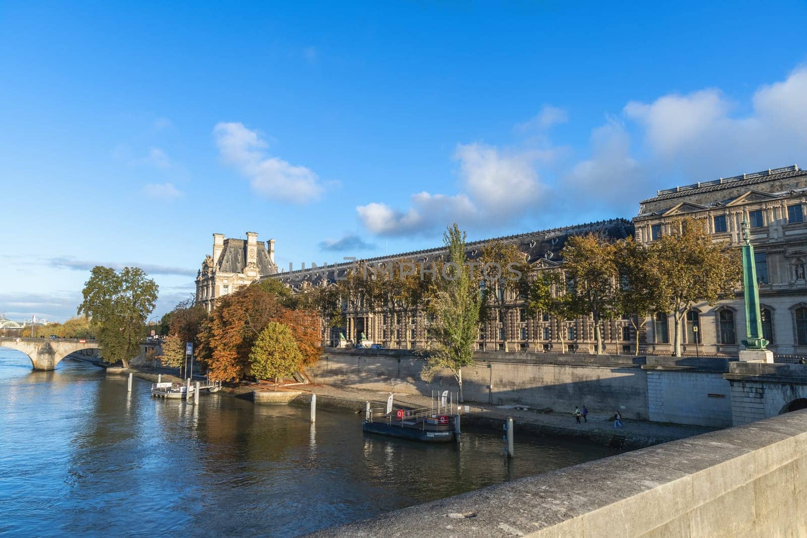 Beautiful cityscape with view of the Seine River and the Louvre Palace. Paris, France - November 1, 2024