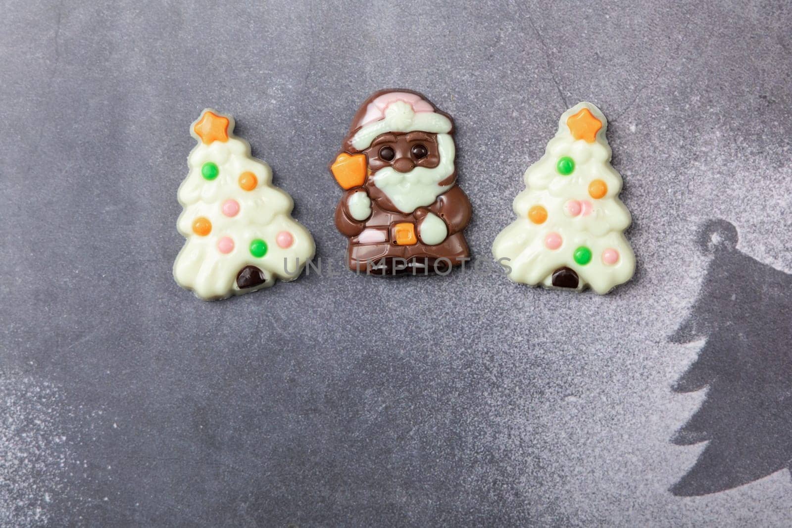 Christmas chocolates. Chocolate Christmas trees and Santa Claus. High quality photo