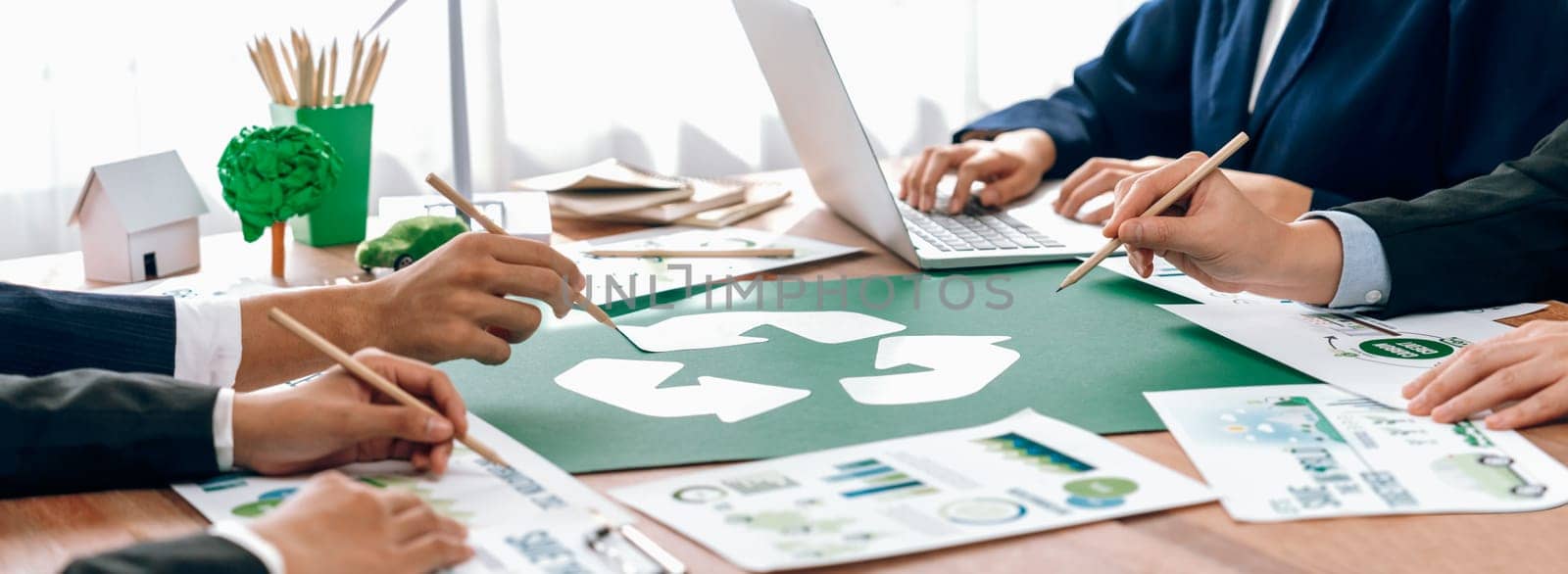 Group of business people planning and discussing on recycle reduce reuse policy symbol in office meeting room. Green business company with eco-friendly waste management regulation concept.Trailblazing