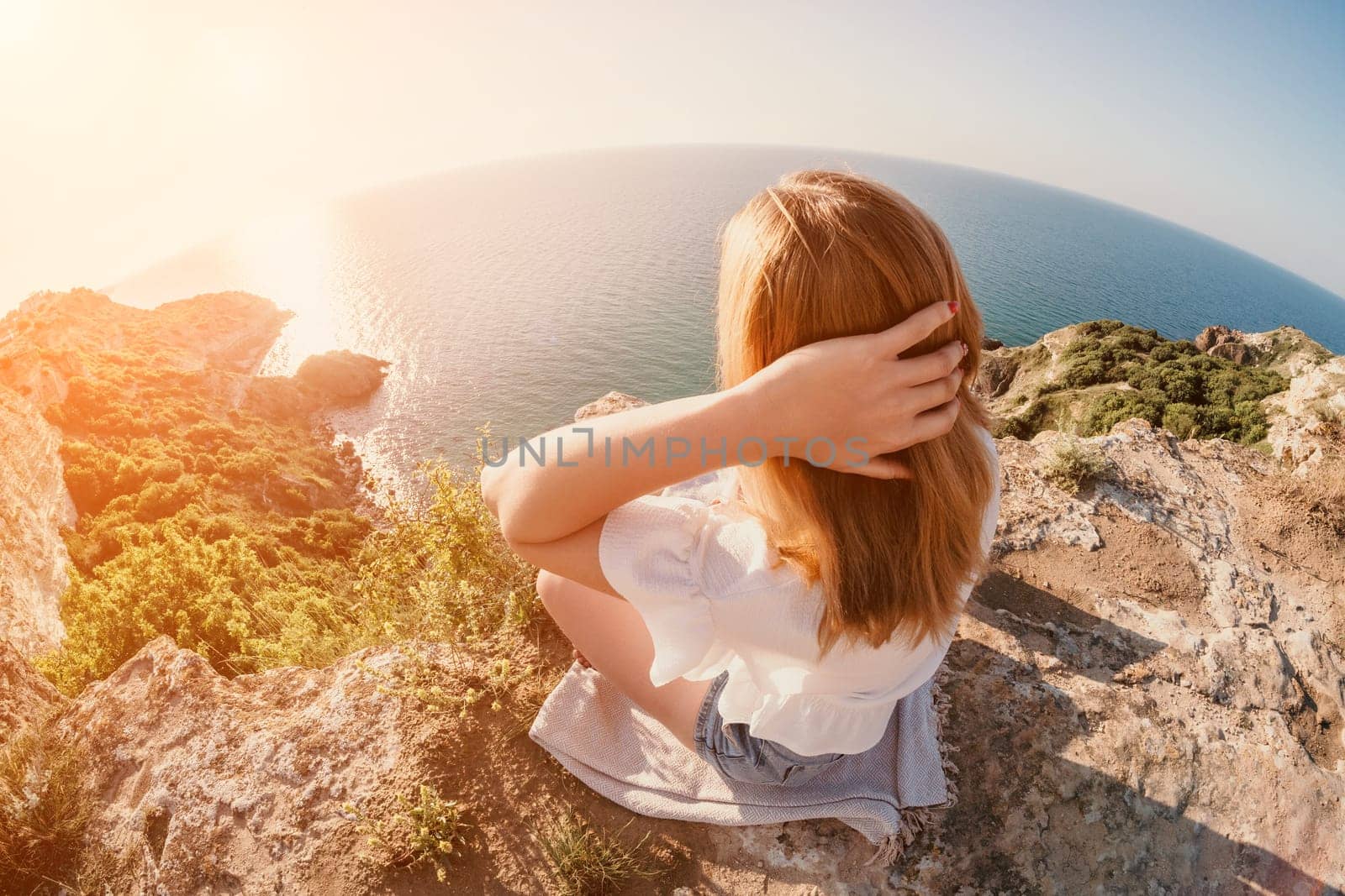 Woman sea laptop. Business woman working on laptop by sea at sunset. Close up on hands of pretty lady typing on computer outdoors summer day. Freelance, digital nomad, travel and holidays concept. by panophotograph