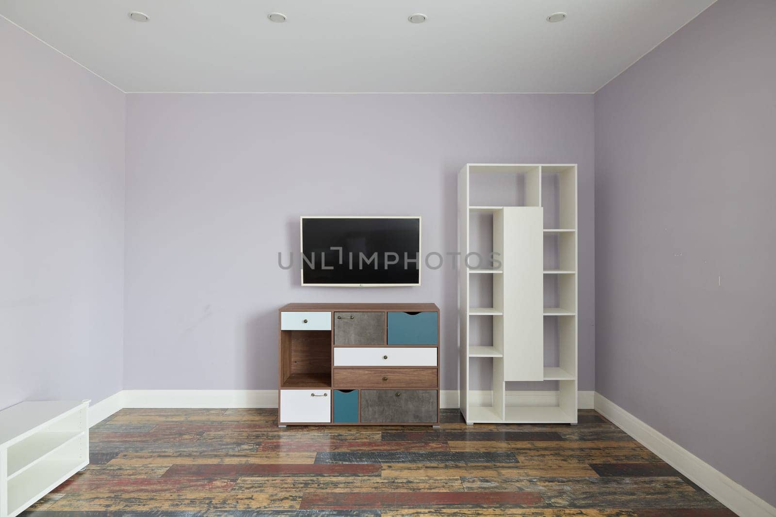 This stylish modern living room showcases minimalist furniture, complemented by a soothing and serene color palette
