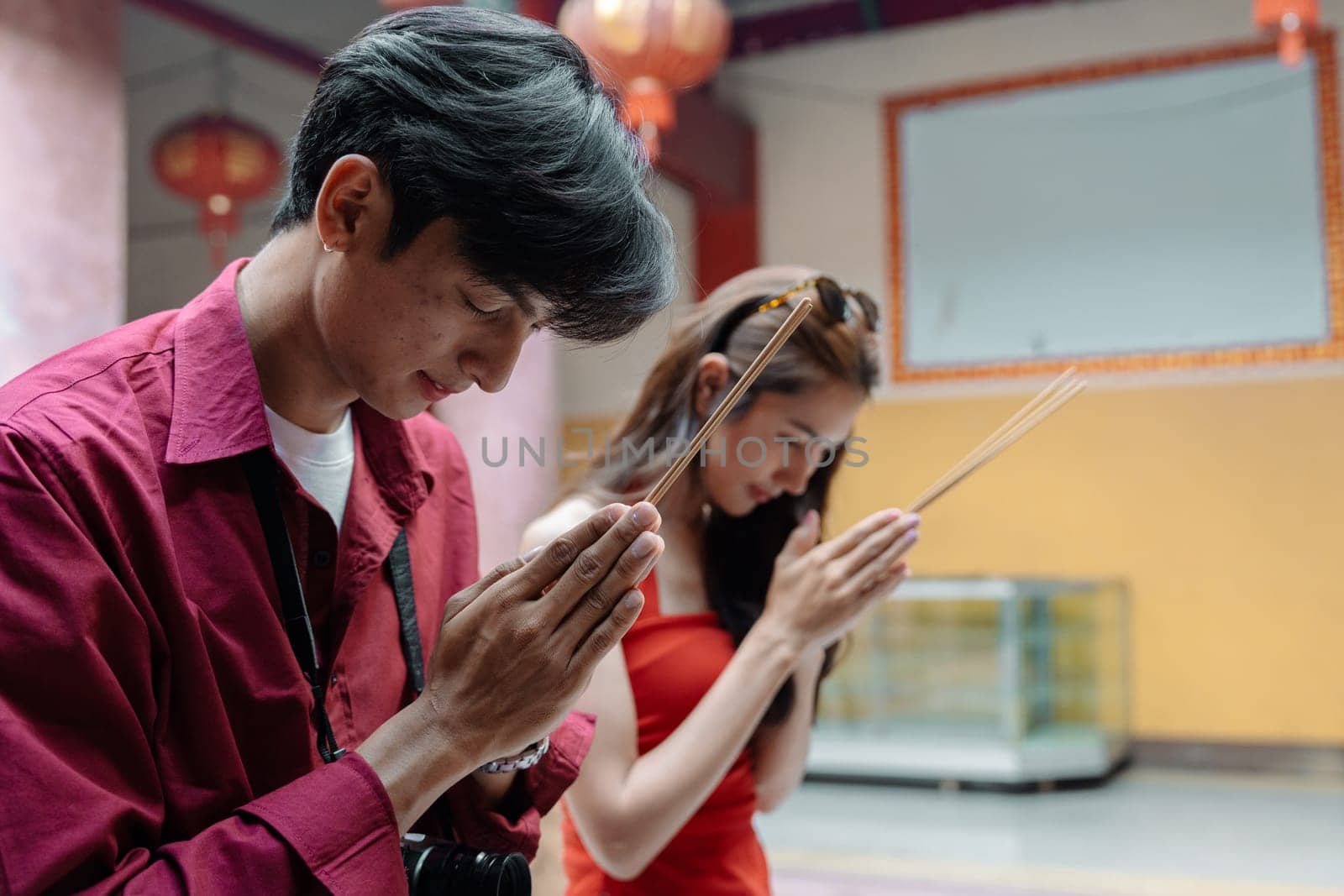 Travelers immerse in vibrant Chinese New Year celebrations, experiencing traditional customs and cultural festivities.