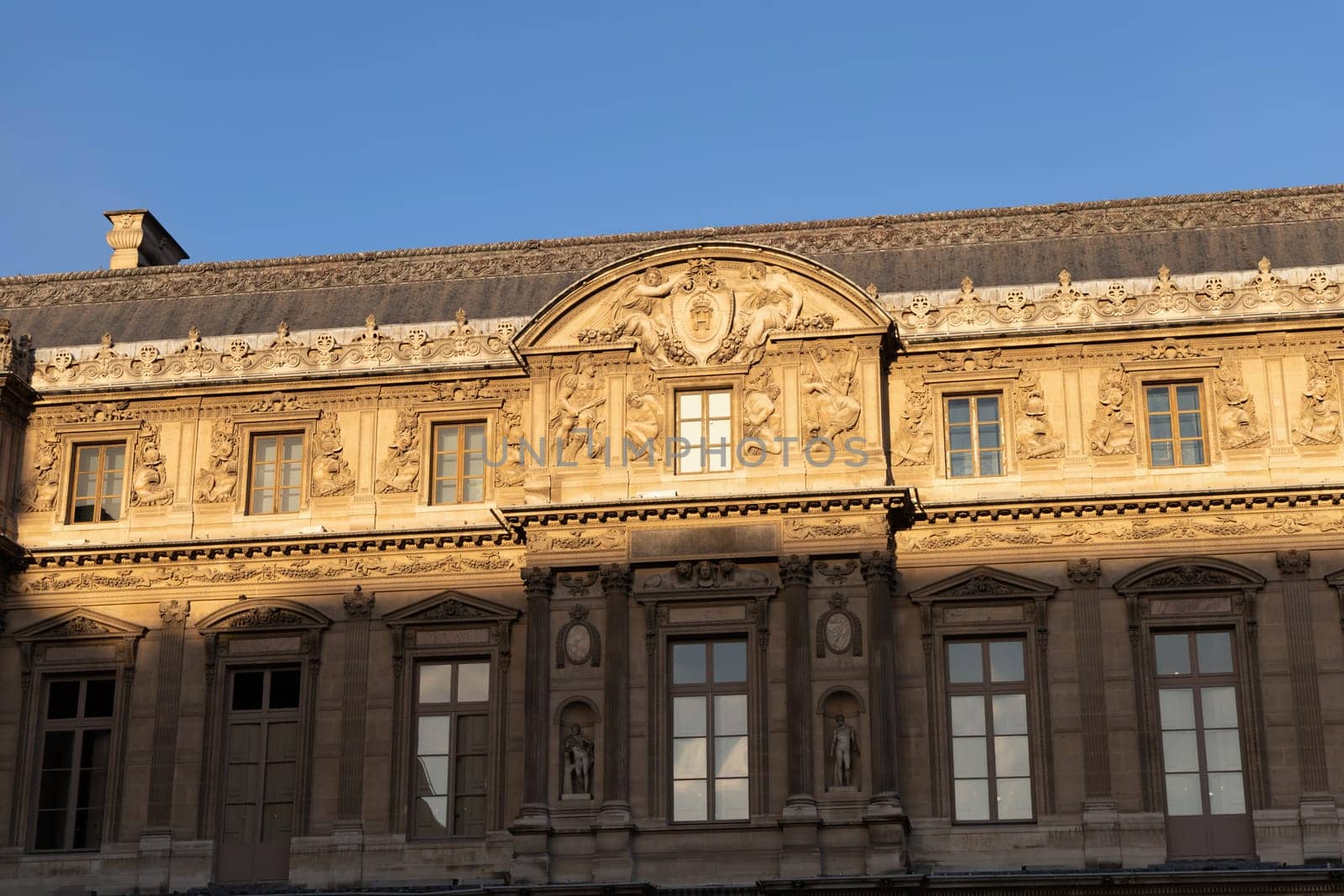 Discover the extraordinary grandeur and beauty of the Louvre Museums stunning and iconic facade located in Paris, France - October 24, 2024