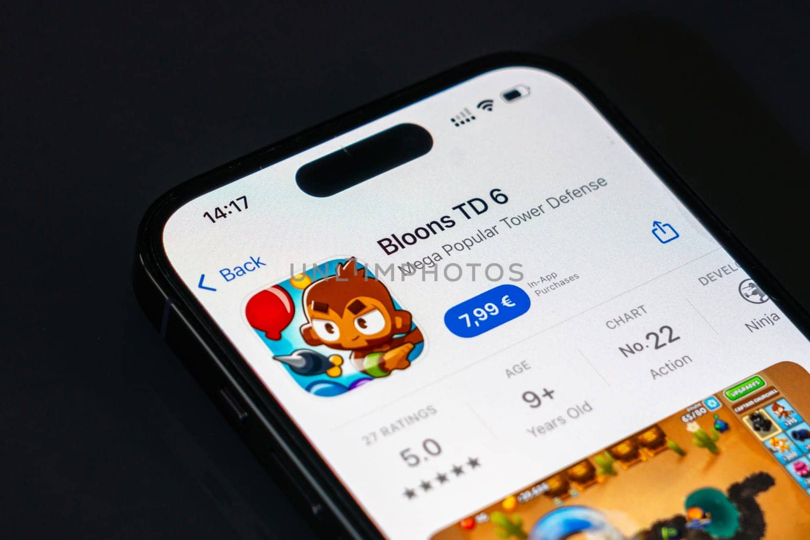 New York, USA - December 20, 2024: Bloons TD 6 game app displayed on smartphone screen with logo. Popular tower defense game with engaging levels and strategy gameplay