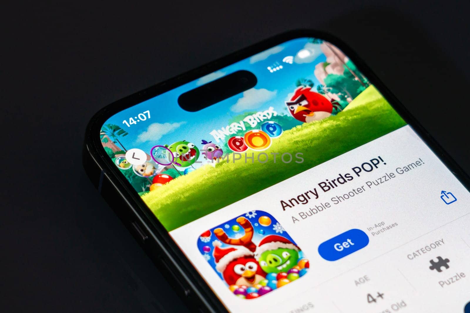 New York, USA - December 20, 2024: Angry Birds POP game app displayed on smartphone screen with logo. Fun mobile puzzle game featuring colorful bubbles and bird characters