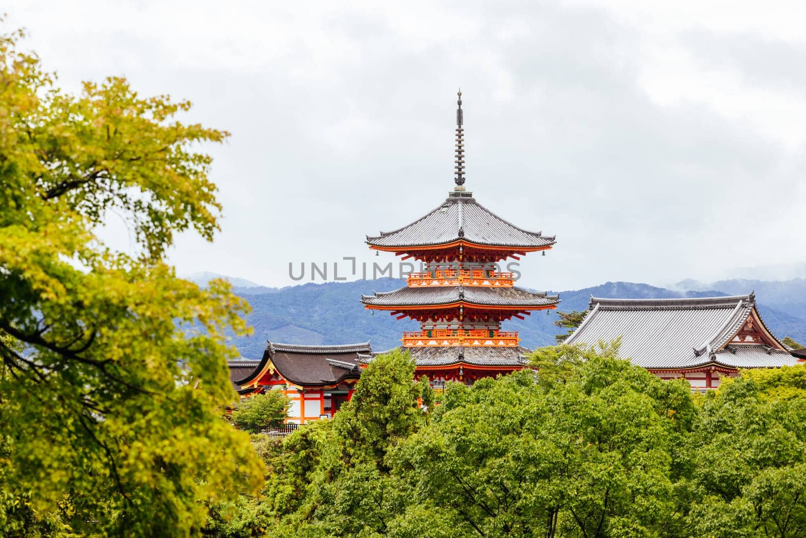 The iconic Kiyomizu-dera temple and mountain view on a sunny spring day in Kyoto, Japan