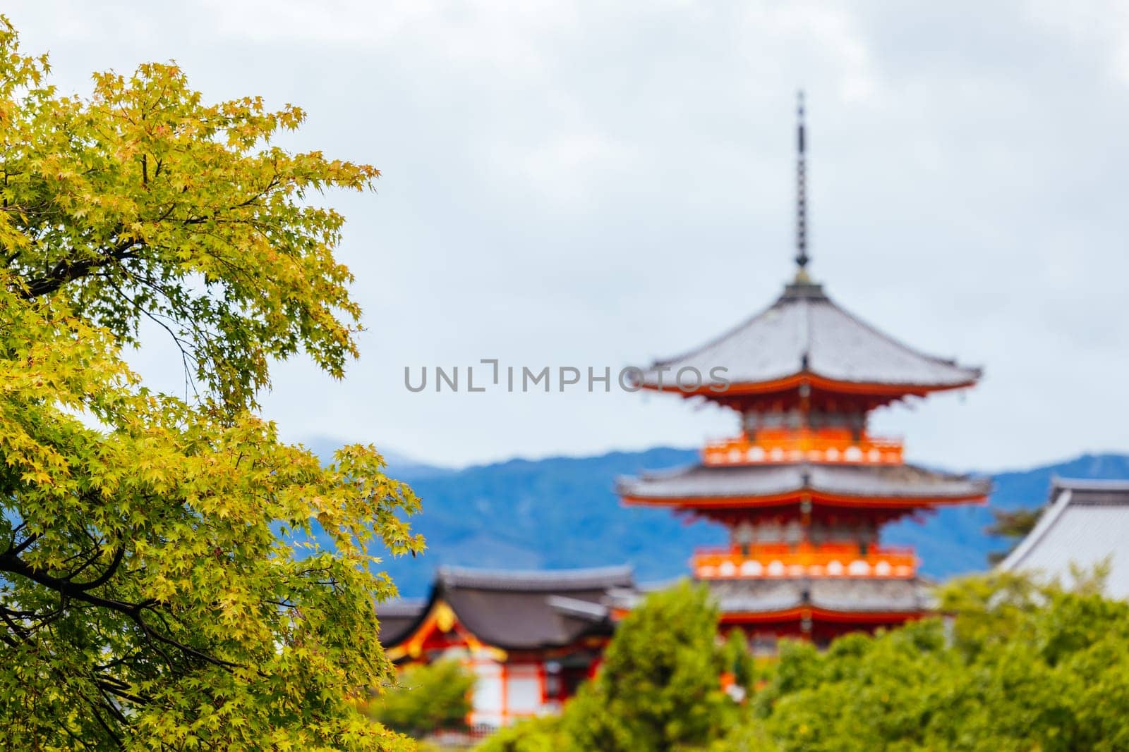 The iconic Kiyomizu-dera temple and mountain view on a sunny spring day in Kyoto, Japan
