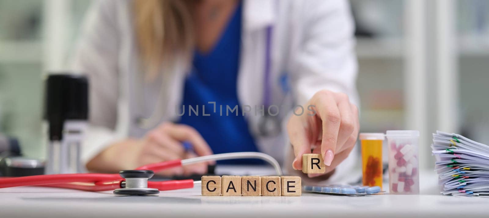 A dedicated healthcare practitioner thoroughly analyzing crucial cancerrelated information and medications