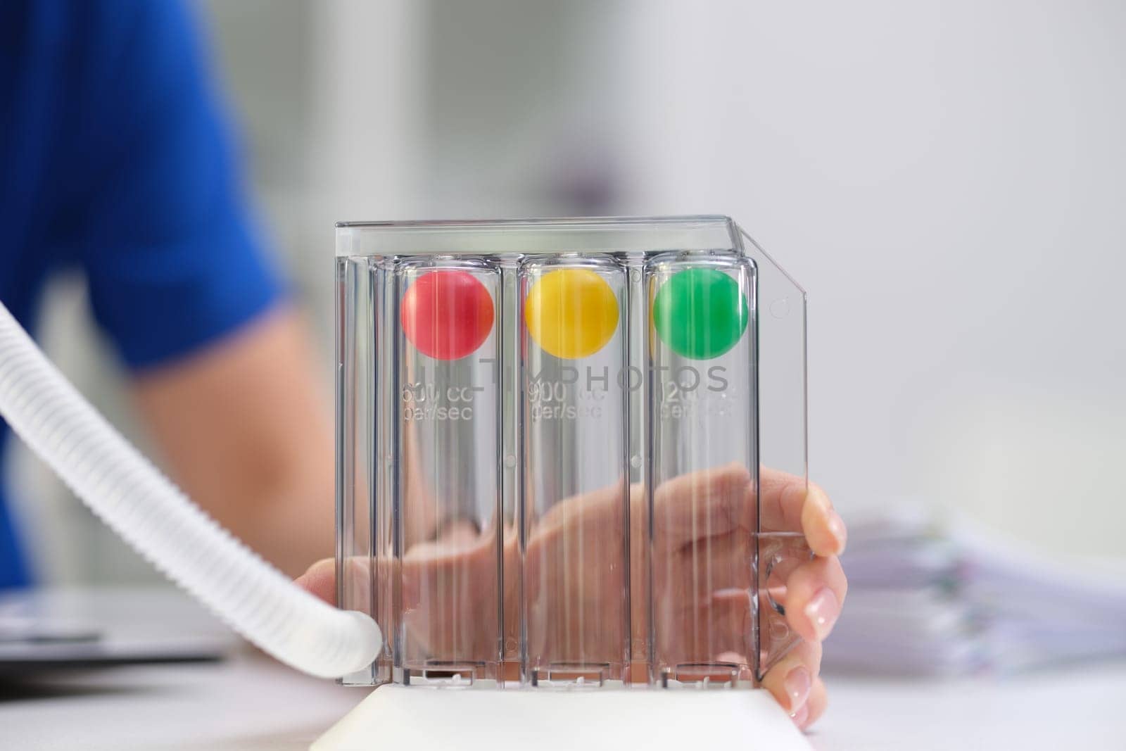 Closeup of a breathing monitor used for assessing pulmonary function, with colorful balls indicating readings