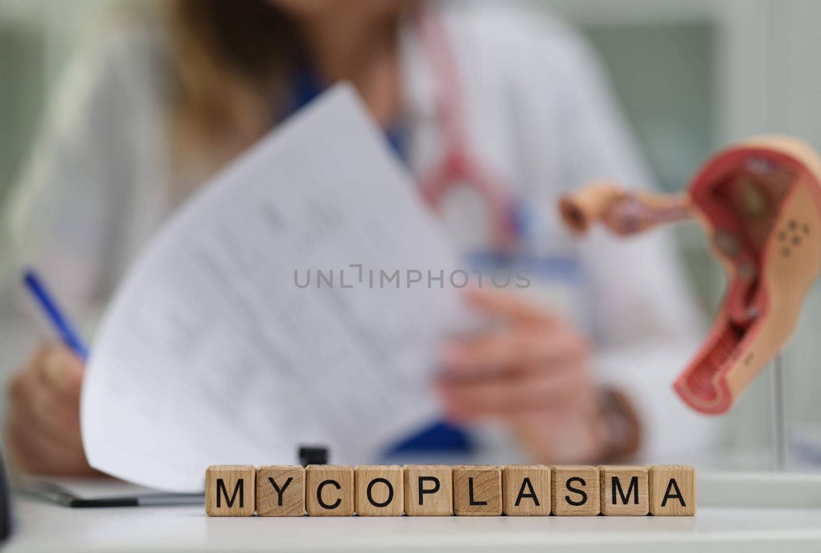 A dedicated medical professional diligently studies mycoplasma, emphasizing its essential role in the healthcare sector