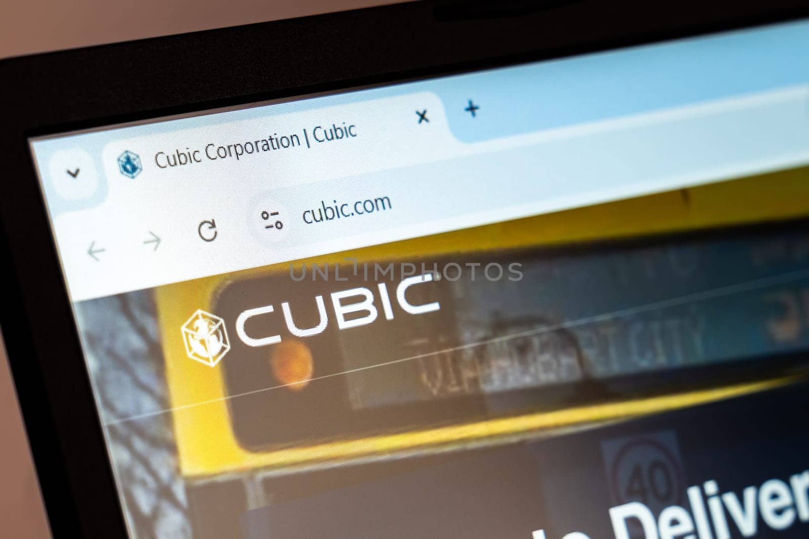 New York, USA - December 21, 2024: Cubic Corporation website homepage displayed on laptop screen with logo. Technology-driven solutions provider for transportation, defense, and training systems