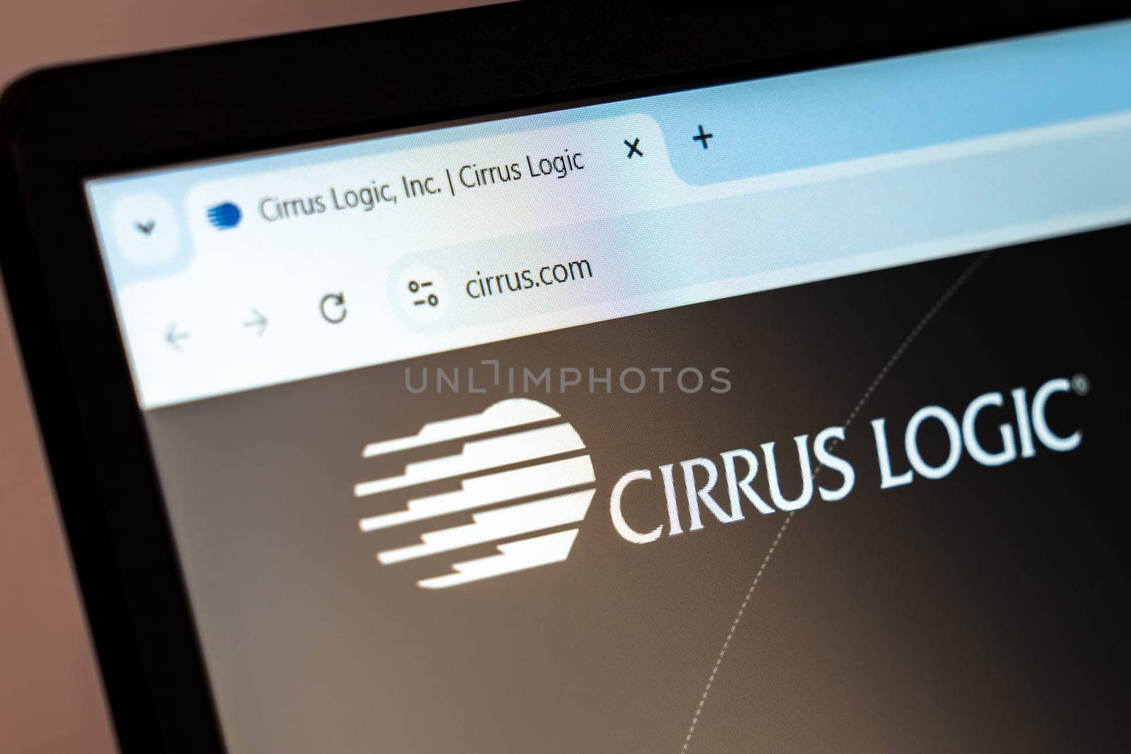New York, USA - December 21, 2024: Cirrus Logic website homepage displayed on laptop screen with logo. Semiconductor company specializing in audio and voice signal processing solutions
