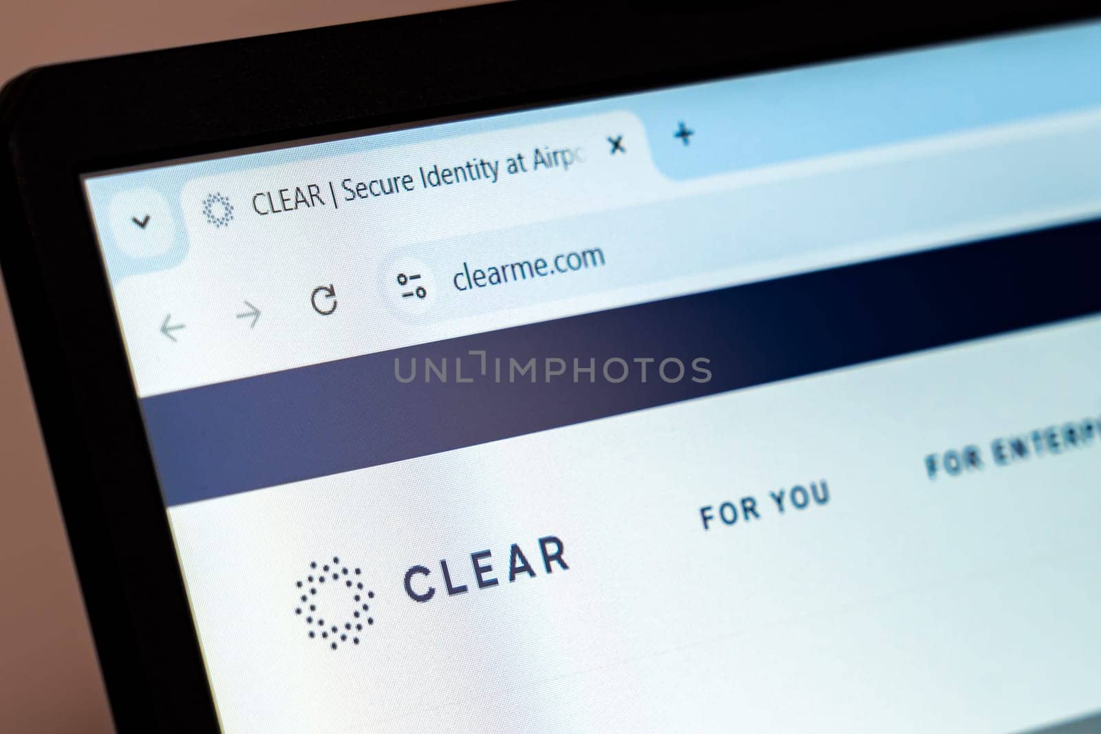 New York, USA - December 21, 2024: CLEAR website homepage displayed on laptop screen with logo. Identity verification platform offering secure biometric screening for travel, stadiums, and events