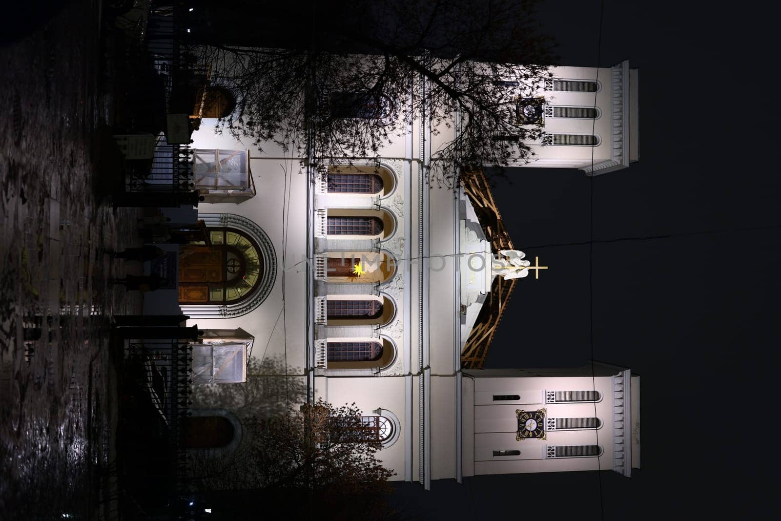 A stunning church beautifully lit at night, showcasing its architectural details against a dark sky.