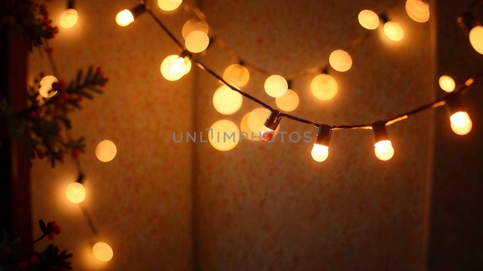 A festive image of Christmas garlands and fairy lights swaying softly. Warm golden and white tones bring a cozy holiday atmosphere to life.
