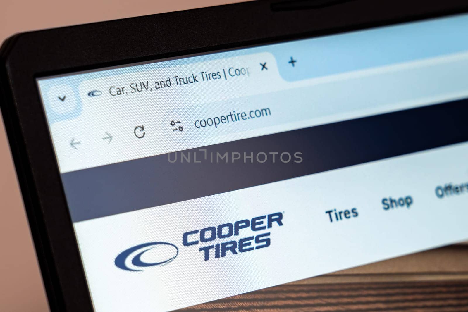 New York, USA - December 21, 2024: Cooper Tires website homepage displayed on laptop screen with logo. Manufacturer of car, SUV, and truck tires