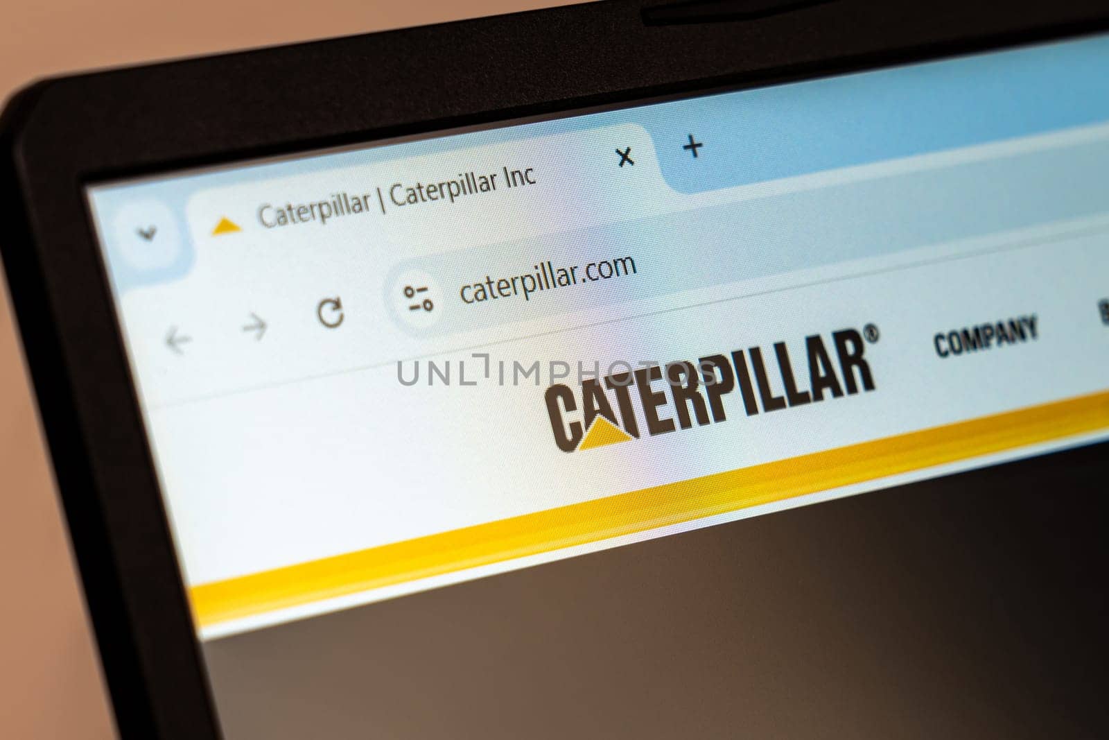 New York, USA - December 21, 2024: Caterpillar website homepage displayed on laptop screen with logo. Manufacturing company specializing in construction and mining equipment