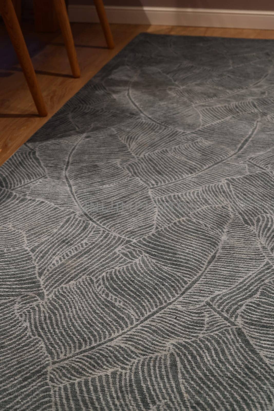 This trendy green area rug, featuring intricate patterns, greatly enhances the modern home decor aesthetics beautifully
