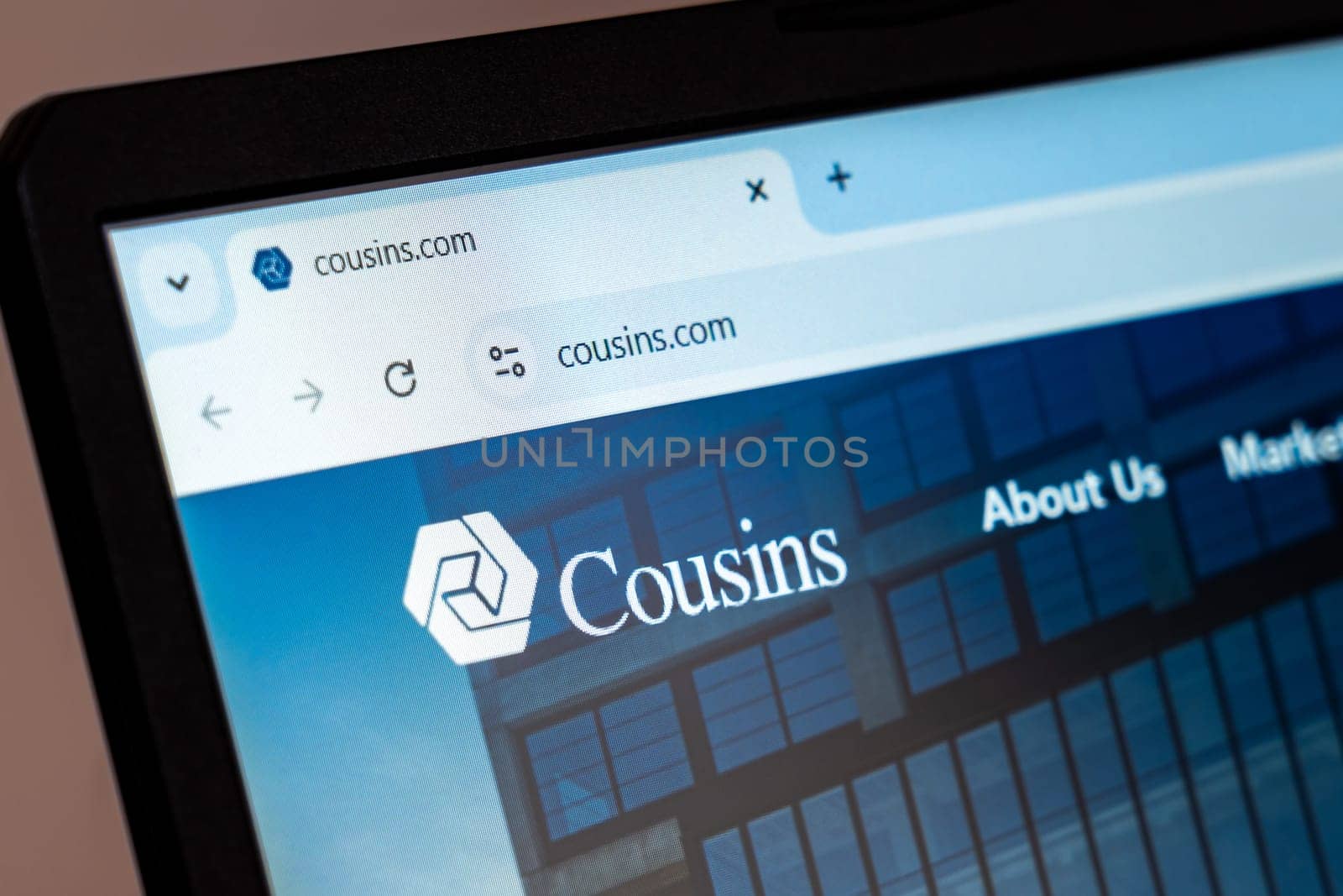 New York, USA - December 21, 2024: Cousins website homepage displayed on laptop screen with logo. Real estate investment company specializing in commercial properties