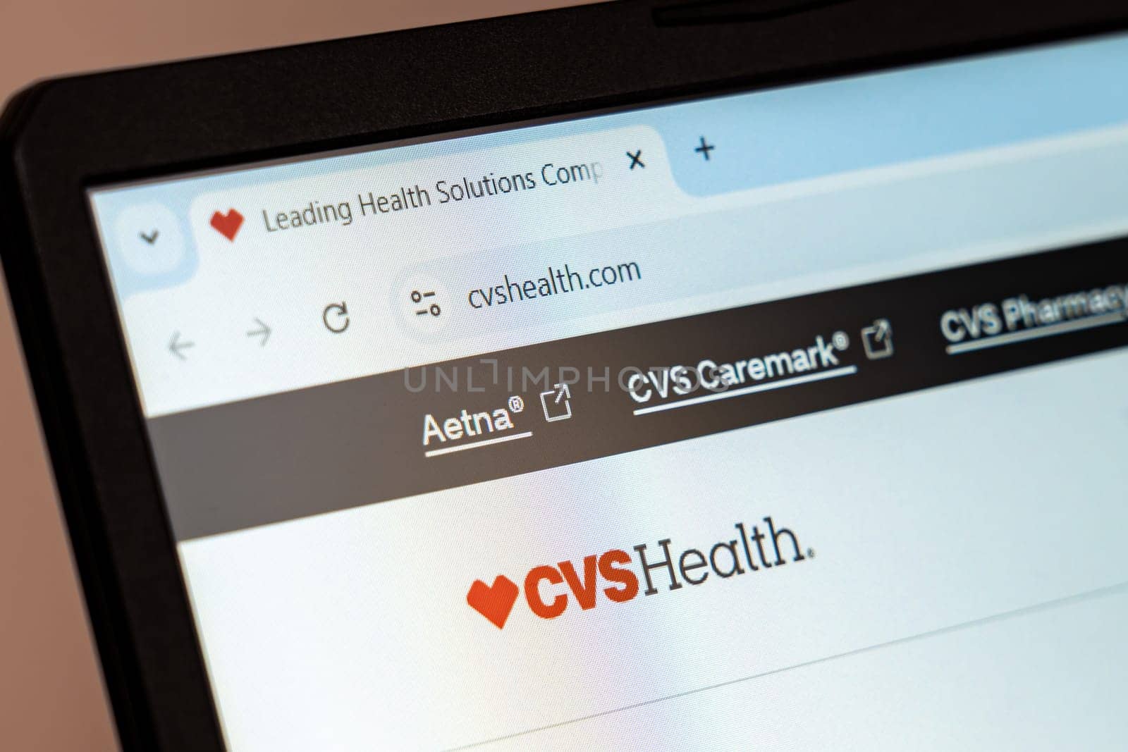New York, USA - December 21, 2024: CVS Health website homepage displayed on laptop screen with logo. Healthcare company offering pharmacy services, insurance, and wellness products