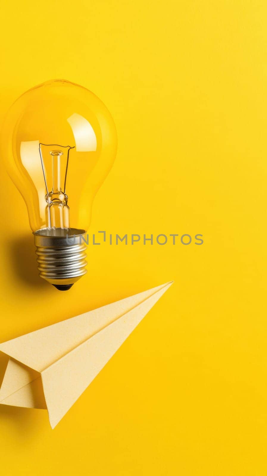 A glowing light bulb and a paper airplane on a bright yellow background represent ideas, creativity, and innovation. The composition is ideal for concepts related to brainstorming, inspiration, and new beginnings